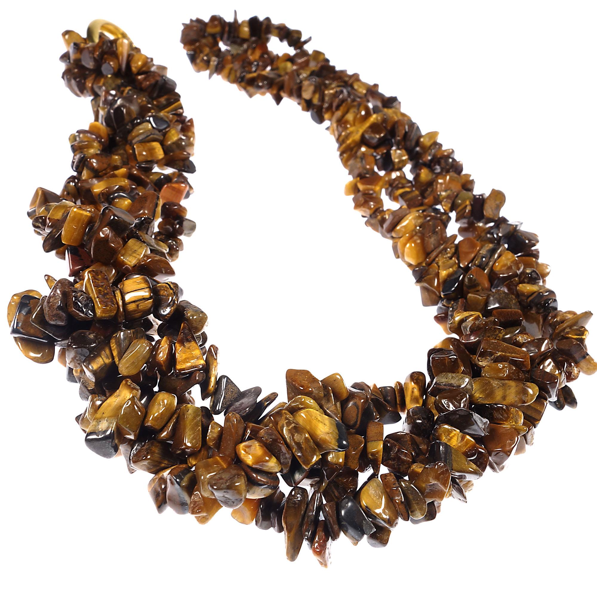 Three 34 inch continuous strands of highly polished Tiger's Eye chips. They can be worn long or doubled and twisted to create a collar effect. Very versatile. These continuous links come with both a gold tone and silver tone clasp. These are perfect