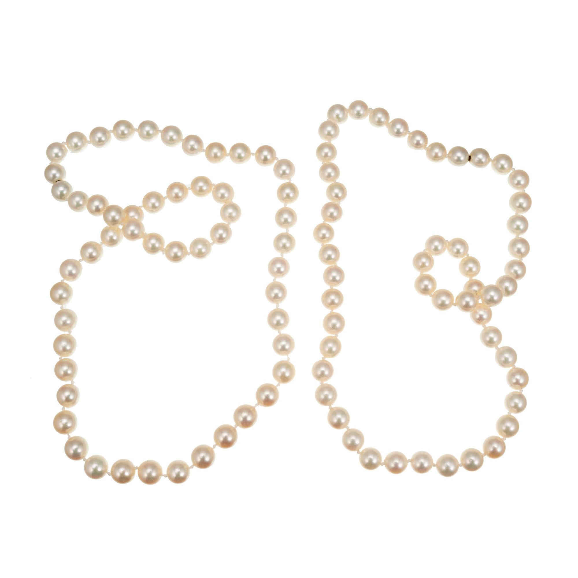 Cultured pearl necklace set with 7.5 to 8mm pearls. 17 Inch and 19 Inch necklaces, both with mystery clasps that allow them to be worn separately, together as a two-strand necklace or joined.

51 cultured white with pink overtones 7.5-8mm pearls
53