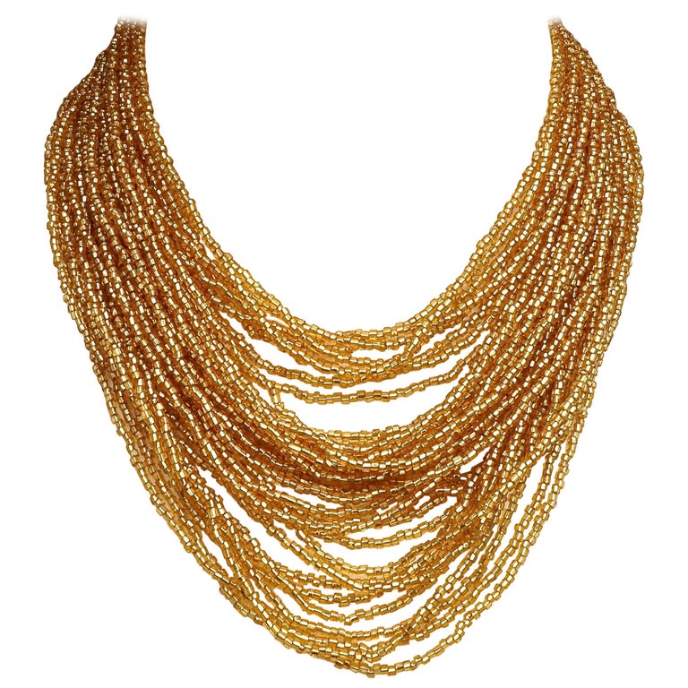 Multi Strand Gold Glass Bead Necklace with Beaded Clasp circa 1960s at
