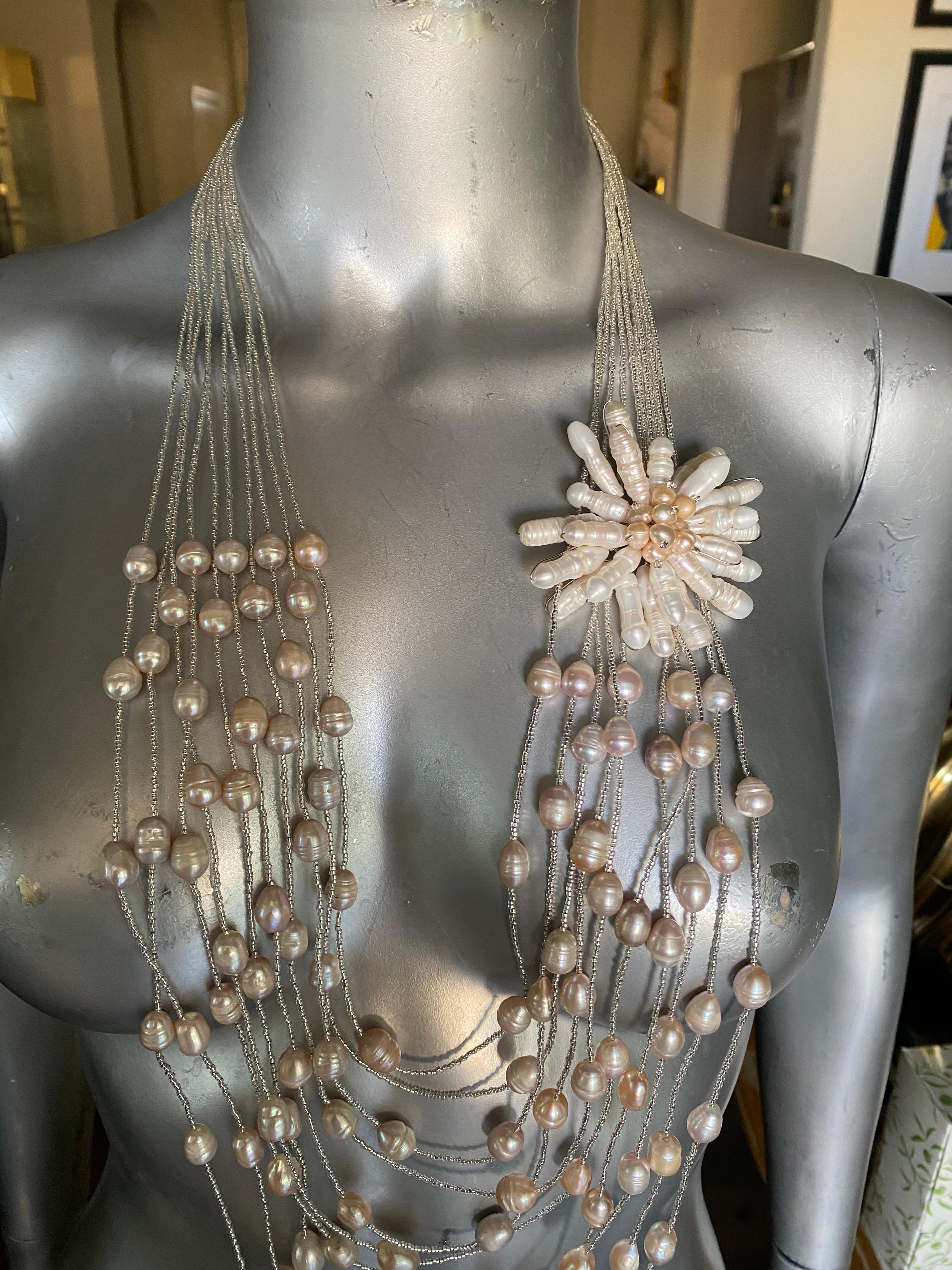 One of the most commented about necklaces we have posted on Instagram. A sold out piece by Italian Company Ottaviani Bijoux. A 10 strand neclace of silver mini beads draped with pearls and mother of pearl beads with signed silver clasp. The accent