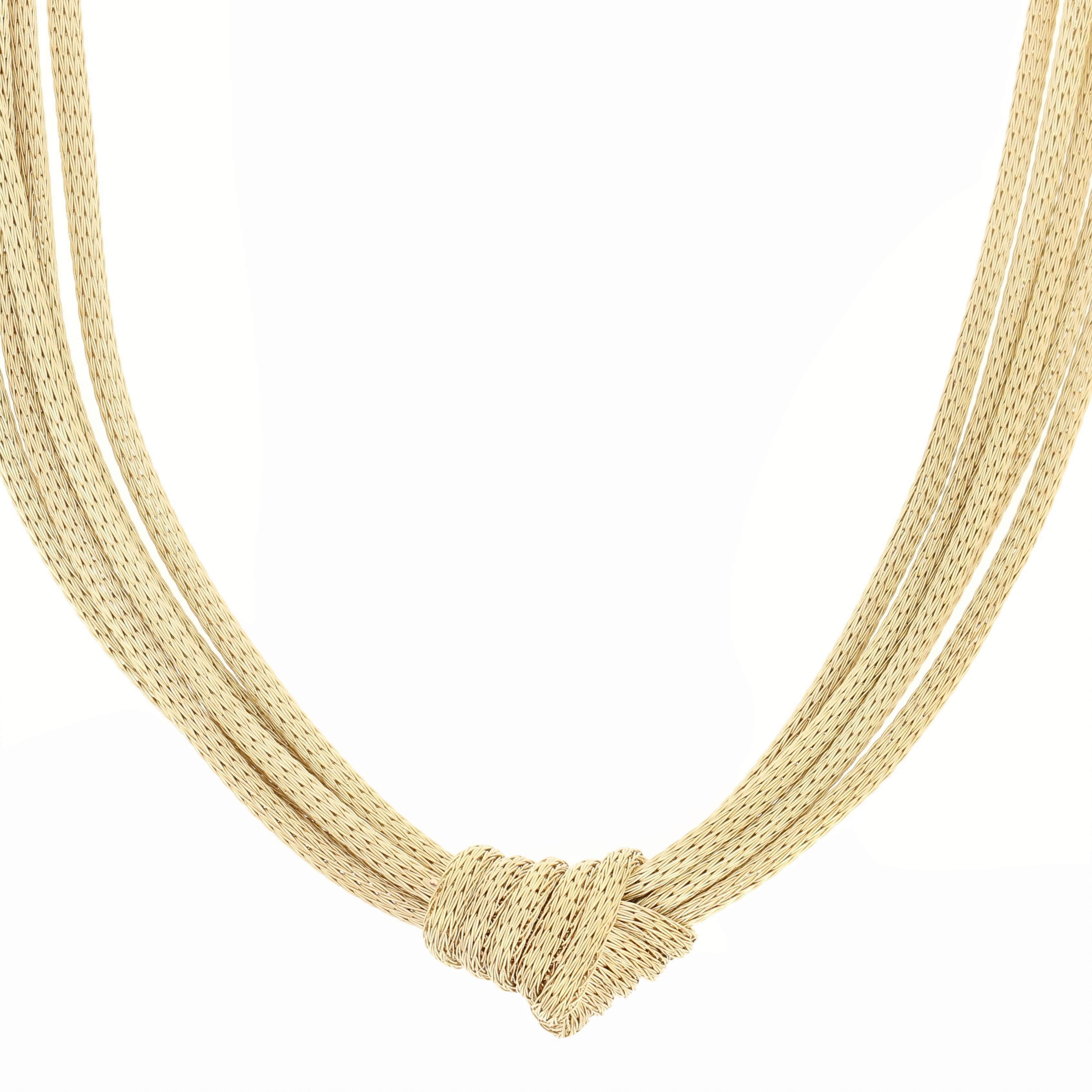 Timelessly beautiful, this Italian necklace is destined to become a treasured favorite in your jewelry collection! This 10k yellow gold piece is composed of five wheat chains that are knotted together in the center and display a luxurious matte