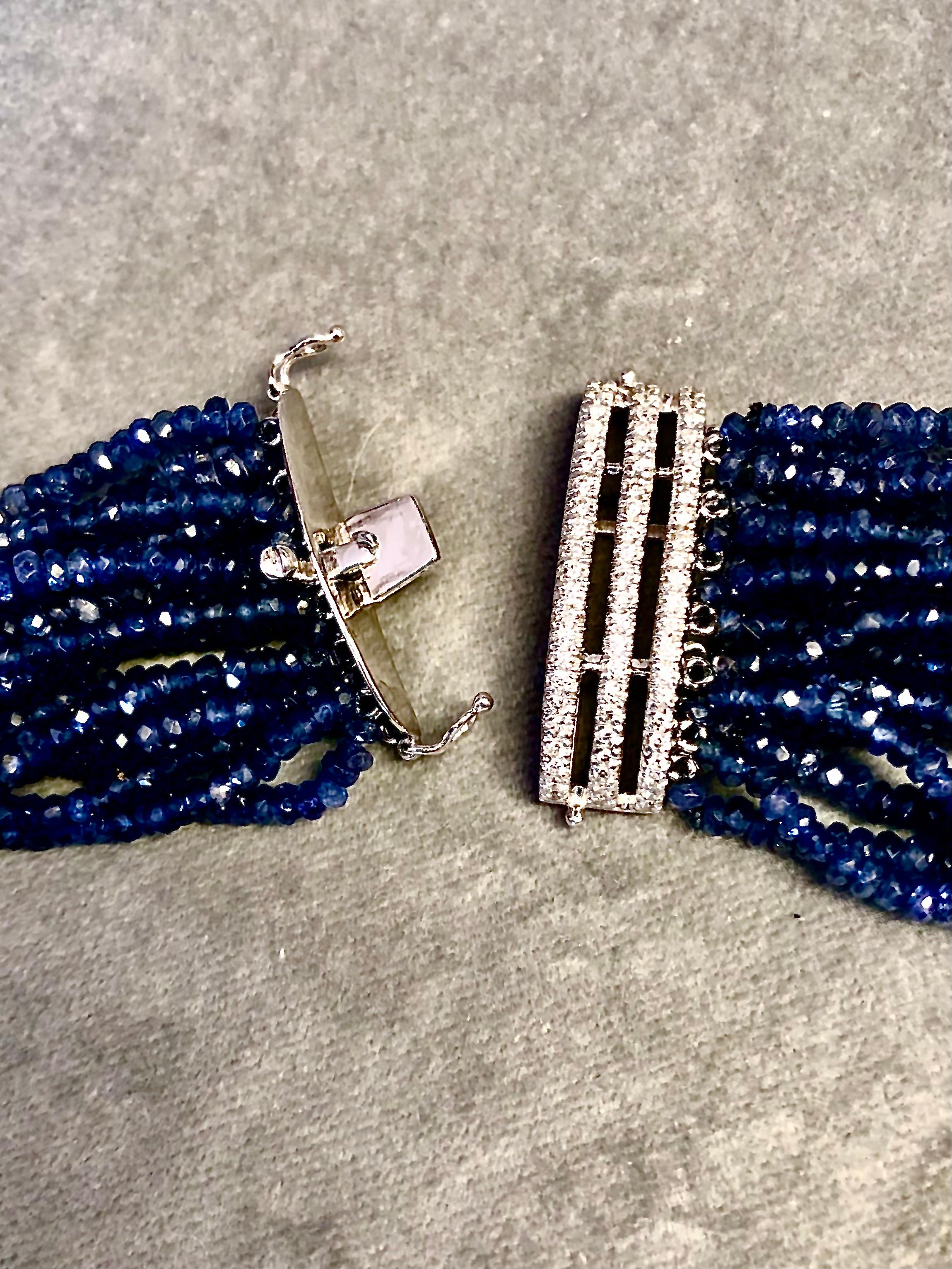 Contemporary Multi strand necklace/choker of deep blue faceted sapphires and diamonds.