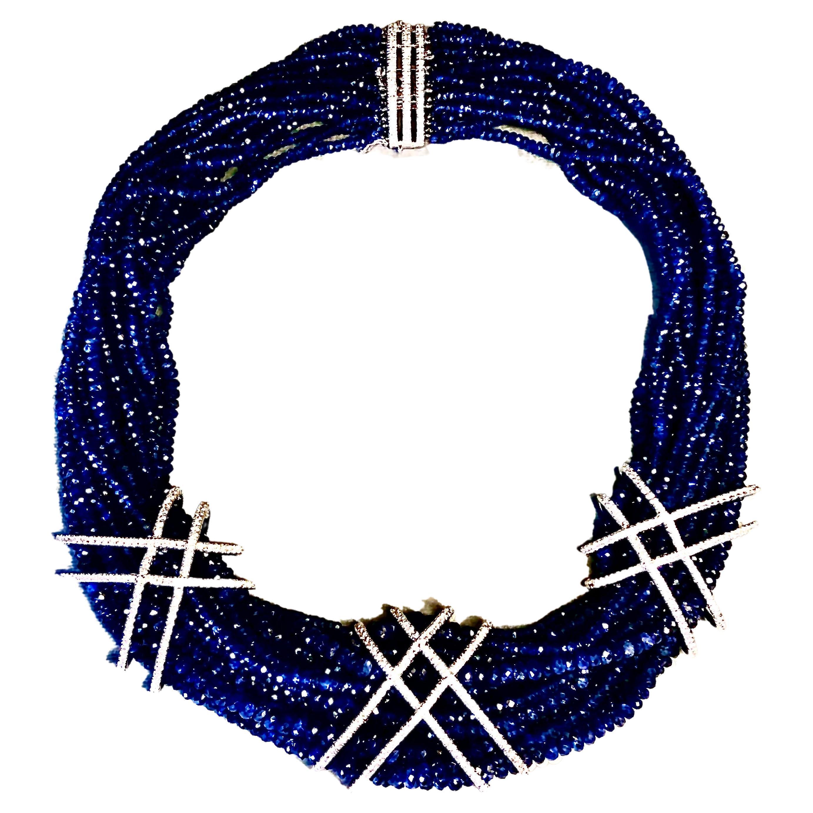Multi strand necklace/choker of deep blue faceted sapphires and diamonds.