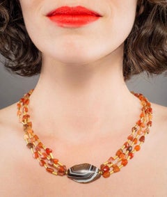 Multi Strand Necklace with Carnelian, Gold Tubes, and Trapezoidal Agate Center