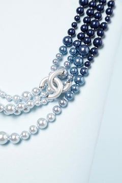 Multi-strand neckless in a blue shading and "Double CC"  brand Chanel