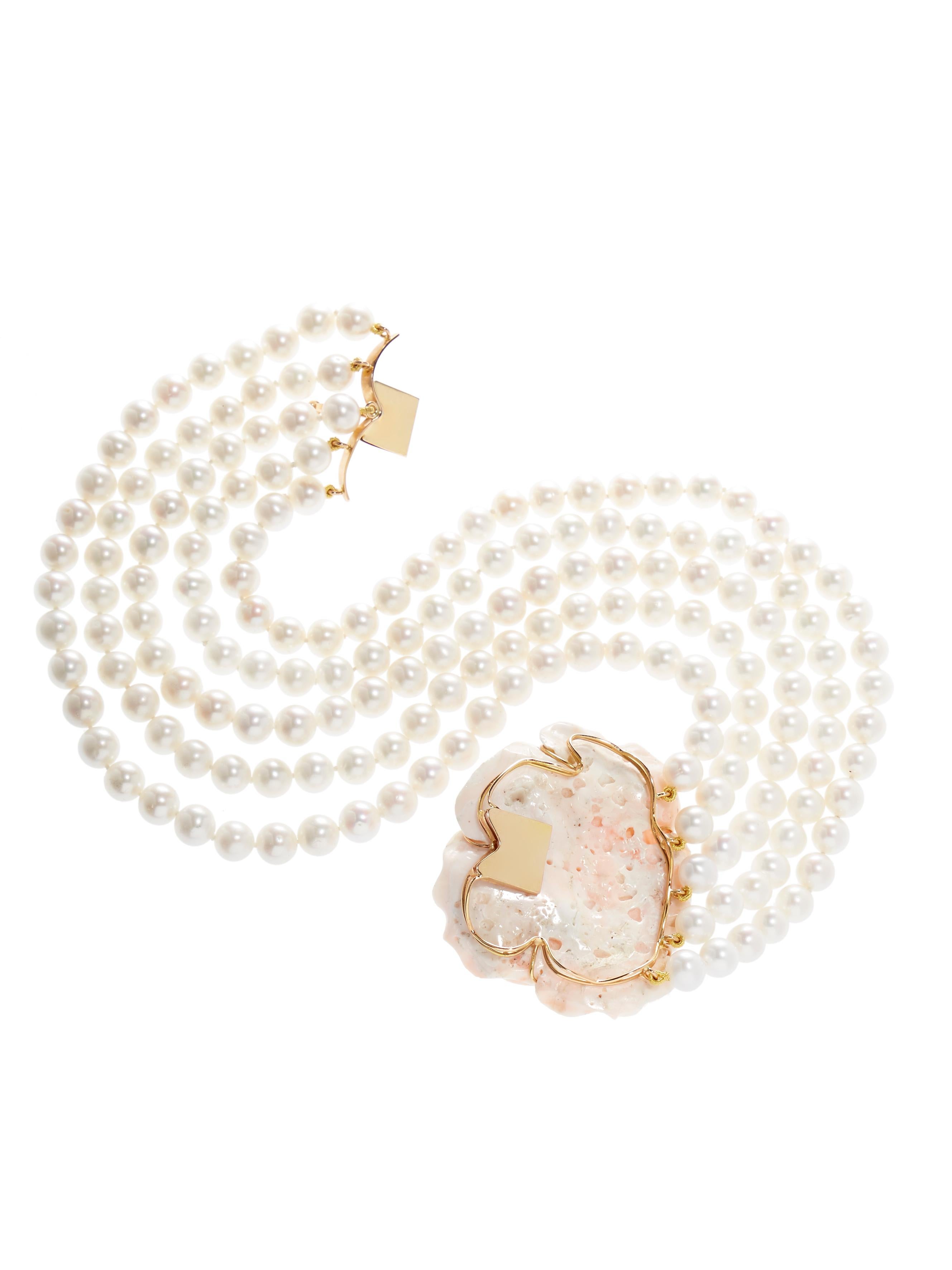 Gorgeous 5-strand pearl necklace with an exquisite large sized carved angel skin coral 18 karat gold clasp. Can be worn with the clasp in the back, although the beautiful clasp is meant to be seen. 

The necklace measures about 37 cm flat.

The