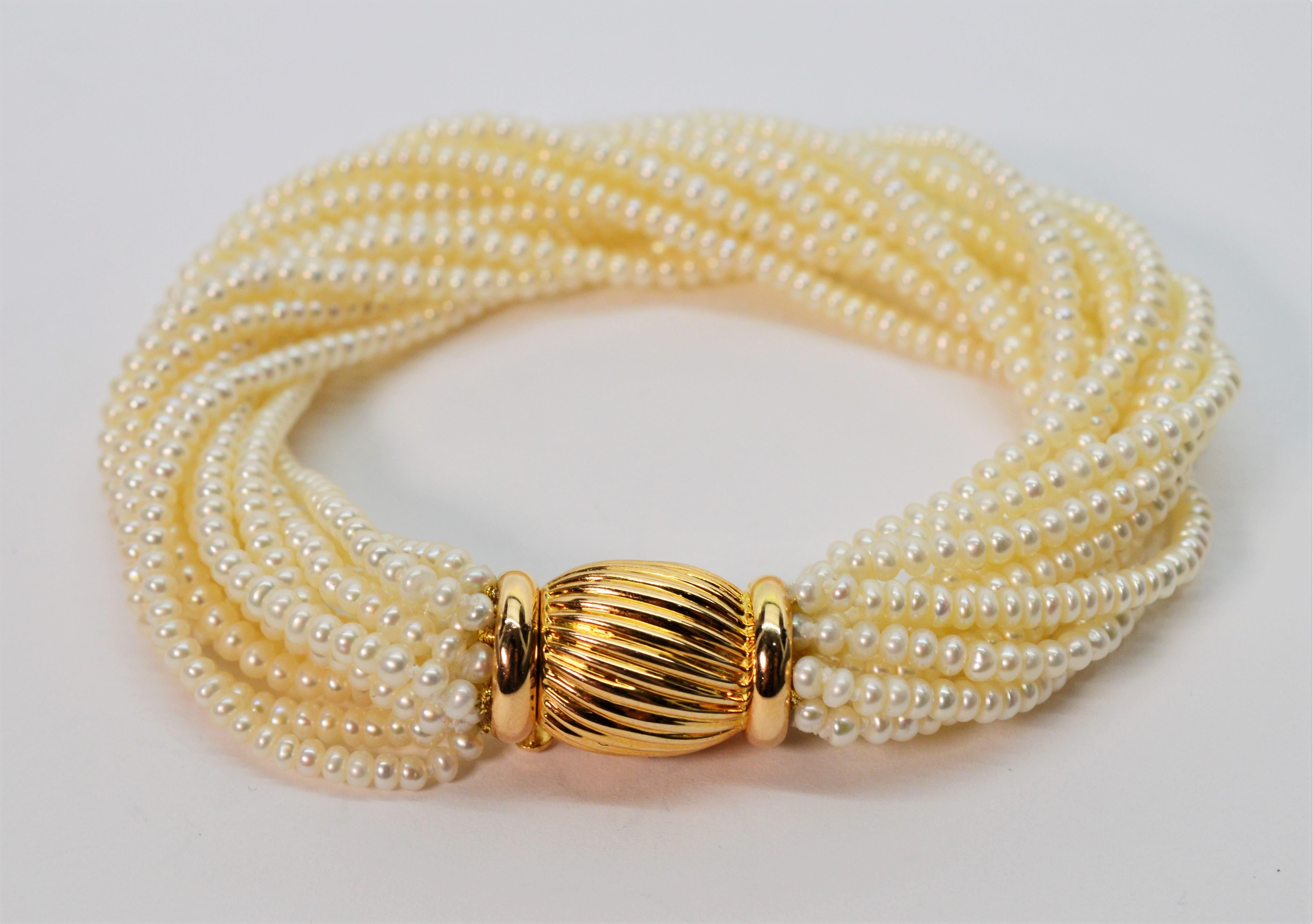 Multi Strand Pearl Wrap Bracelet with Decorative Yellow Gold Bow Tie Clasp In New Condition For Sale In Mount Kisco, NY