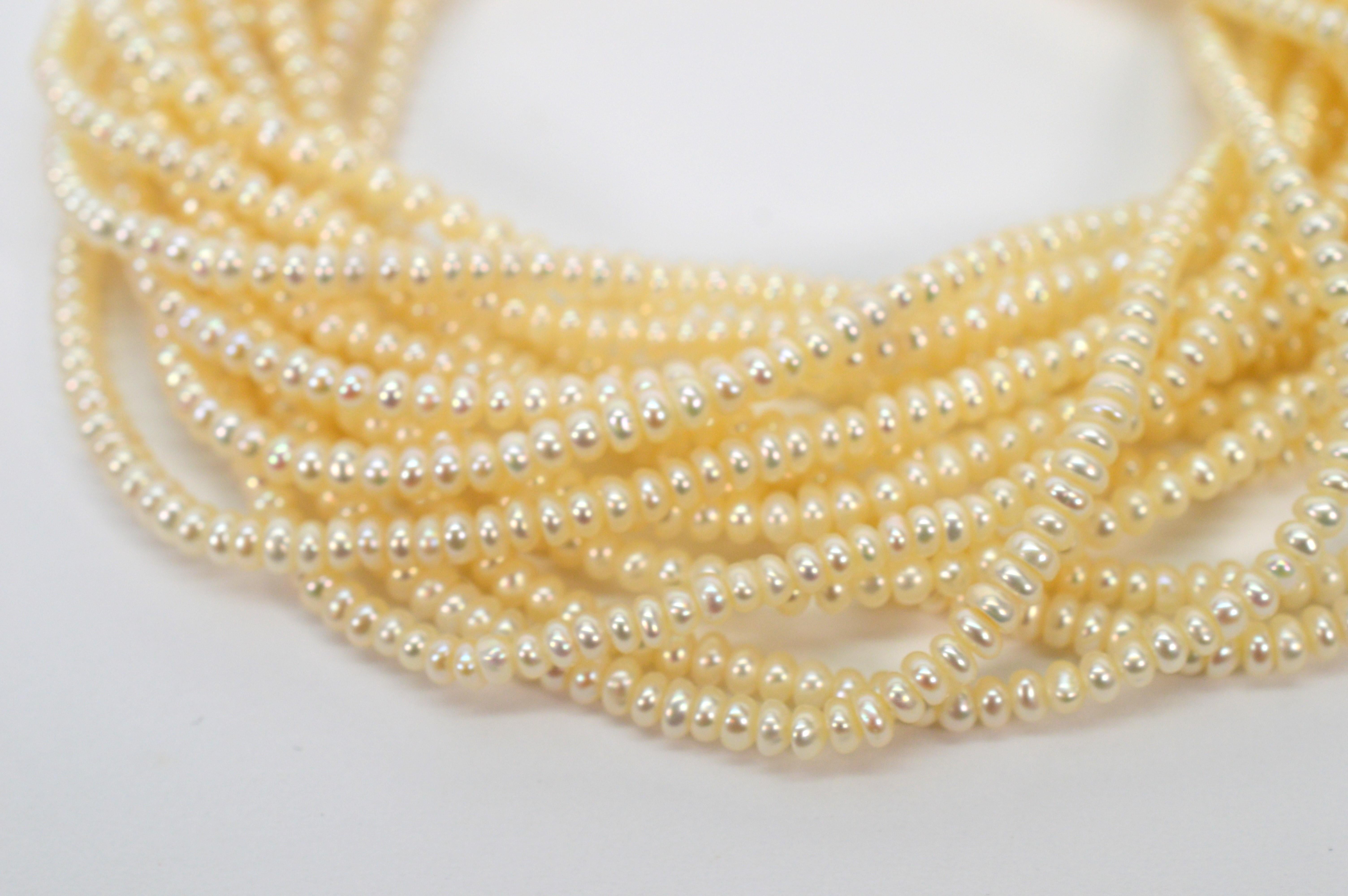 Multi Strand Pearl Twist Bracelet with Decorative 14K Yellow Gold Bow Tie Clasp For Sale 4