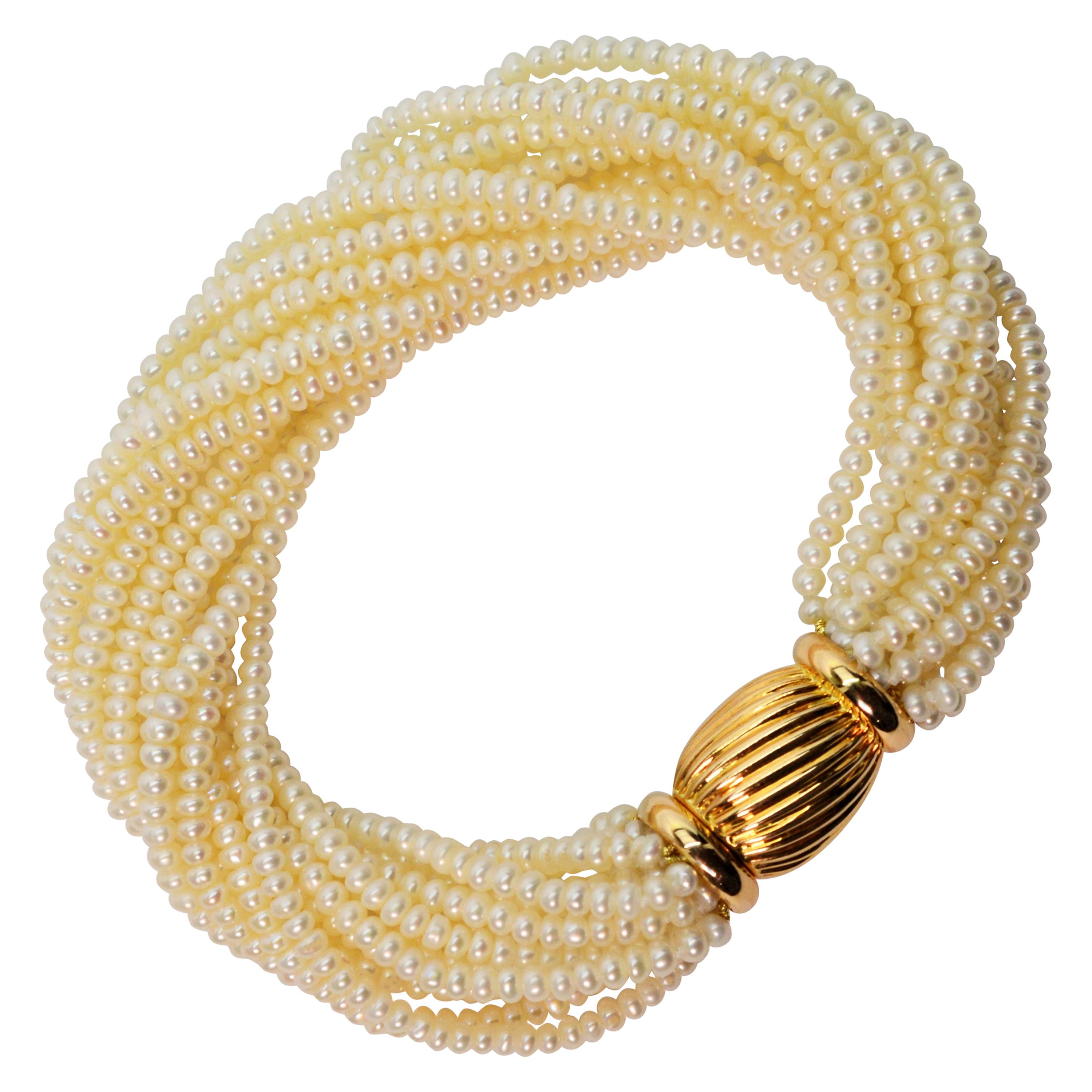 Multi Strand Pearl Wrap Bracelet with Decorative Yellow Gold Bow Tie Clasp For Sale