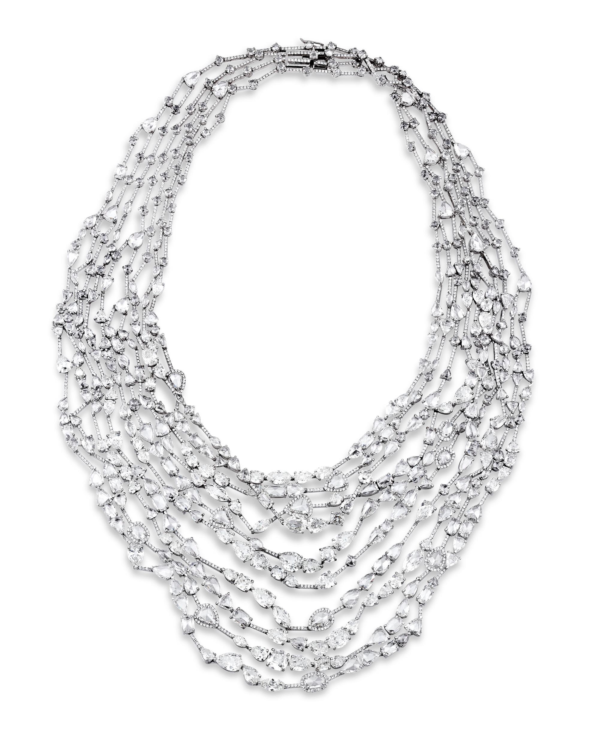 An array of rose-cut and faceted diamonds are set in this spectacular multi-strand necklace. The jewels weigh a combined 83.03 total carats and are cut in oval, pear, round and other dazzling shapes meticulously set in 18K white gold. 

The rose cut