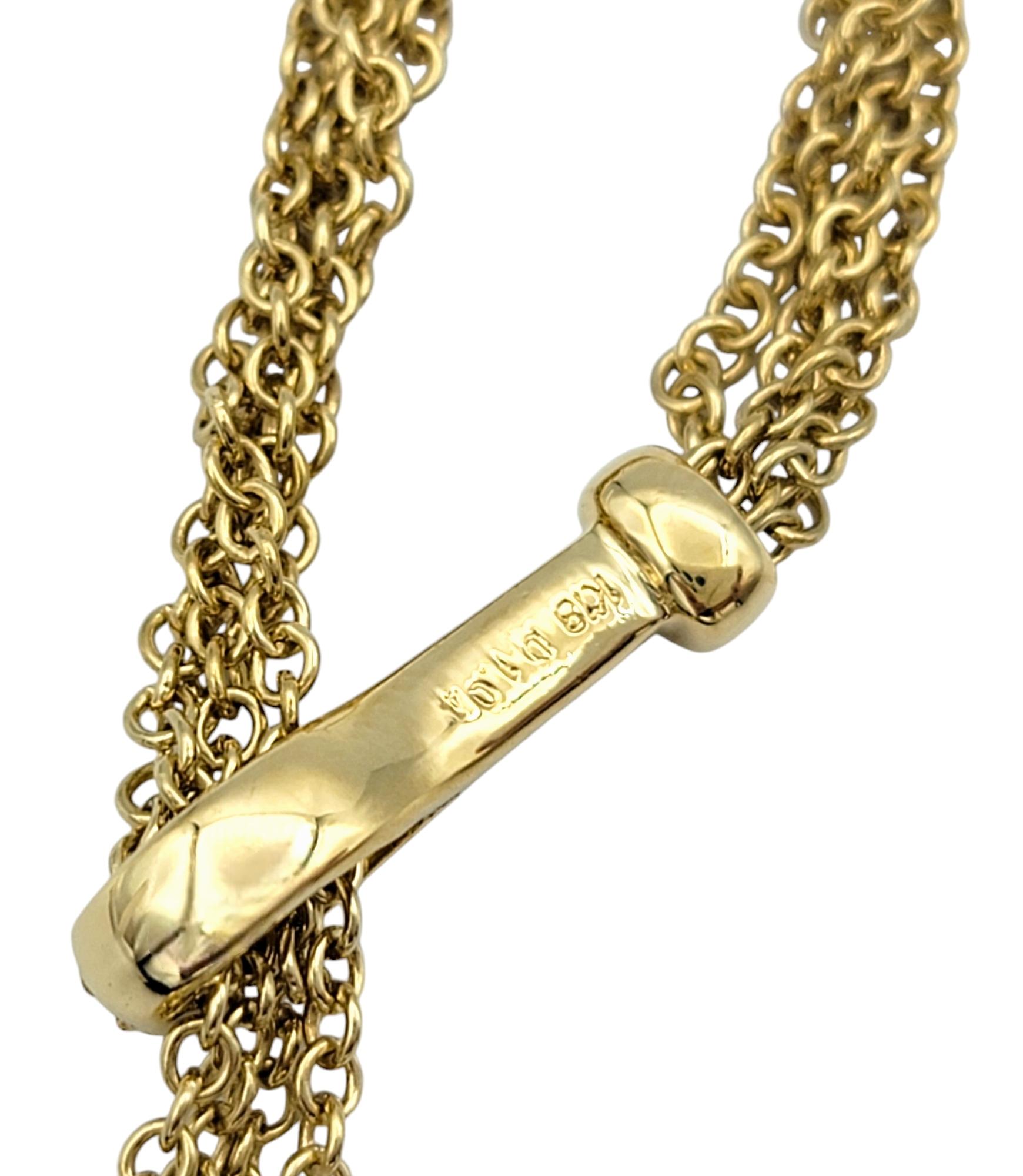 Mehrstrangige gestufte Diamant-Halo-Tropfen-Halskette aus 18 Karat Gelbgold im Angebot 1