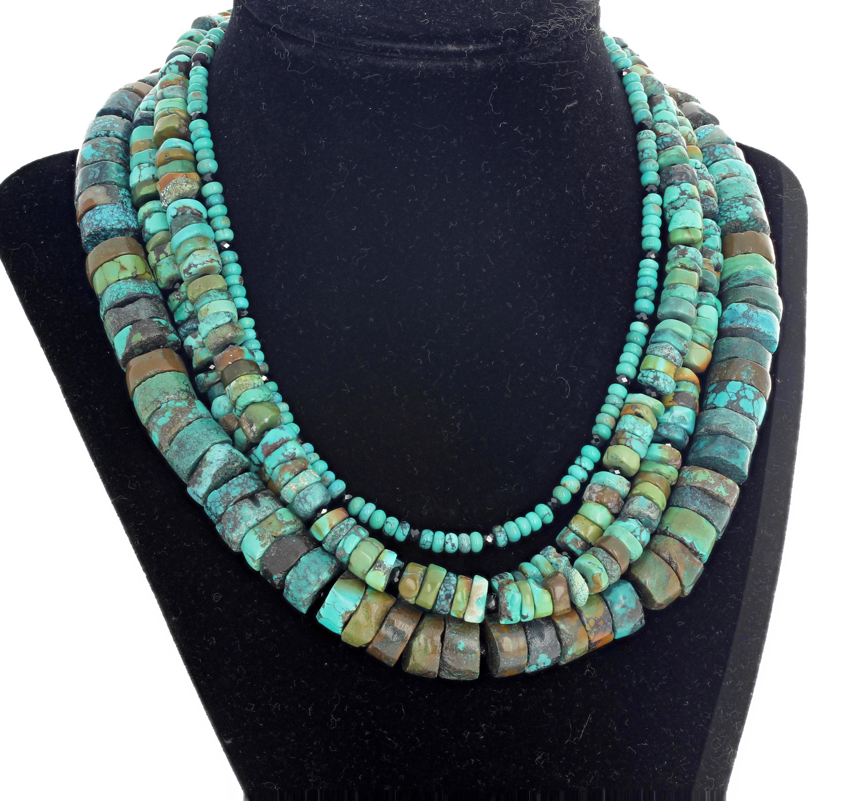 This 15 inch long - 4 strands -  real Turquoise necklace is adorned with sparkling gem cut little black Spinels with a silver tone clasp.  More from this seller by putting gemjunky into 1stdibs search bar.