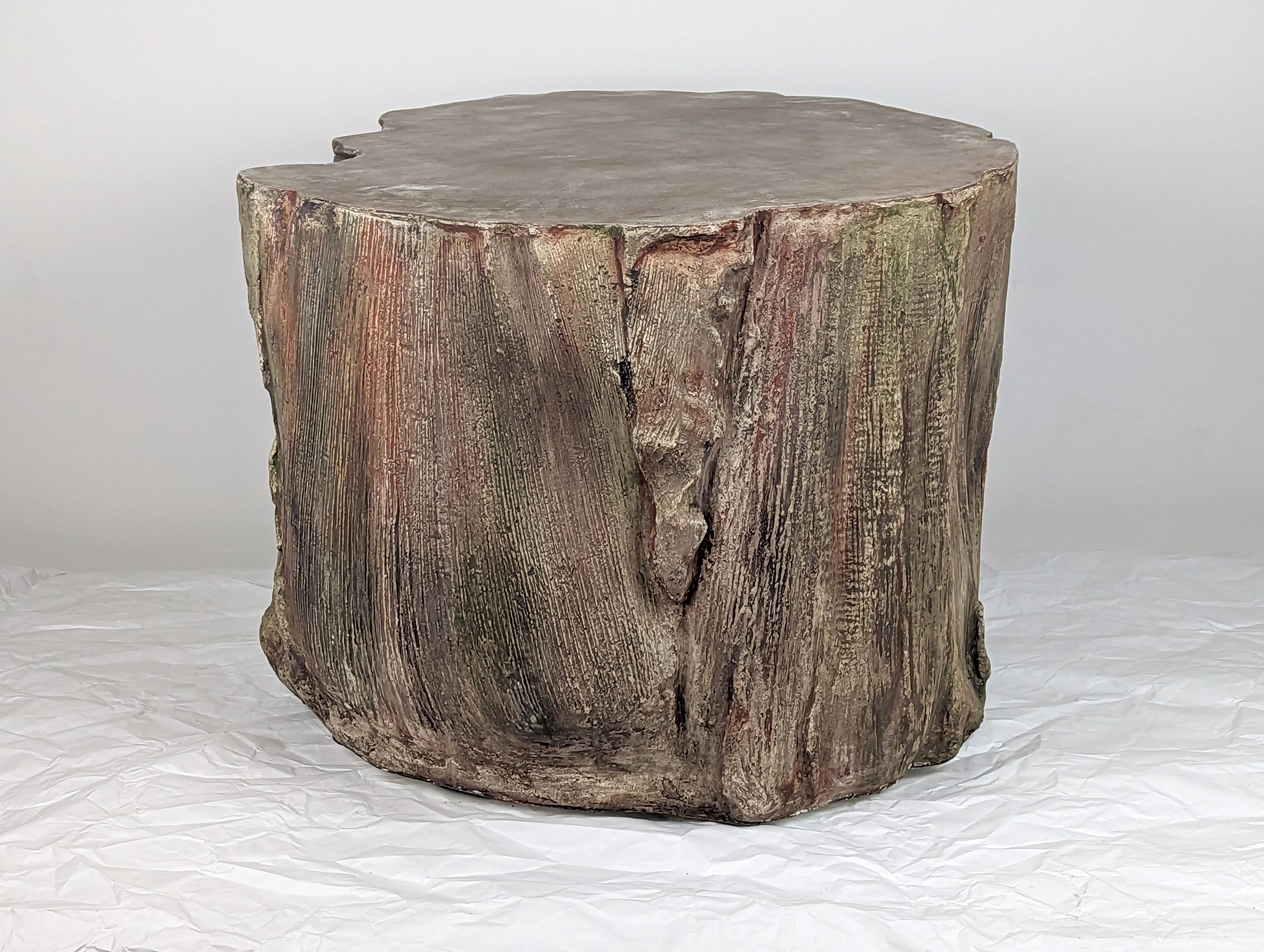 Bring the feeling of a mountain into your home with a one of a kind, organic and sculptural concrete coffee table molded from palm frond seedpods, reminiscing of a stump or wood grain. This biophilic work is colored with various tones of browns,