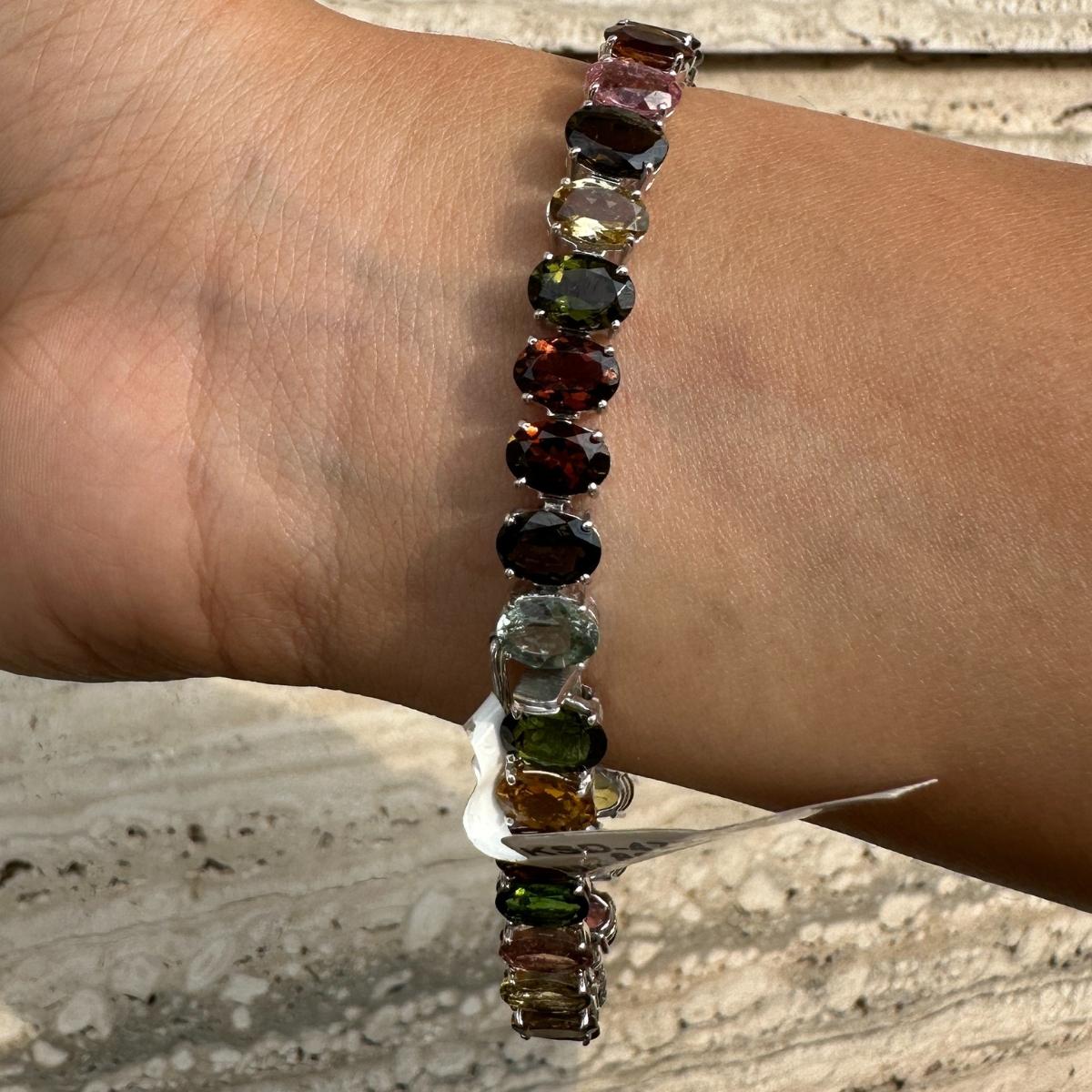 Multi Tourmaline Tennis Bracelet in sterling silver showcases endlessly sparkling natural multi tourmaline. It measures 7.5 inches long in length. 
Multi Tourmuline stimulate concentration and reduces stress. 
Designed with perfect oval cut multi