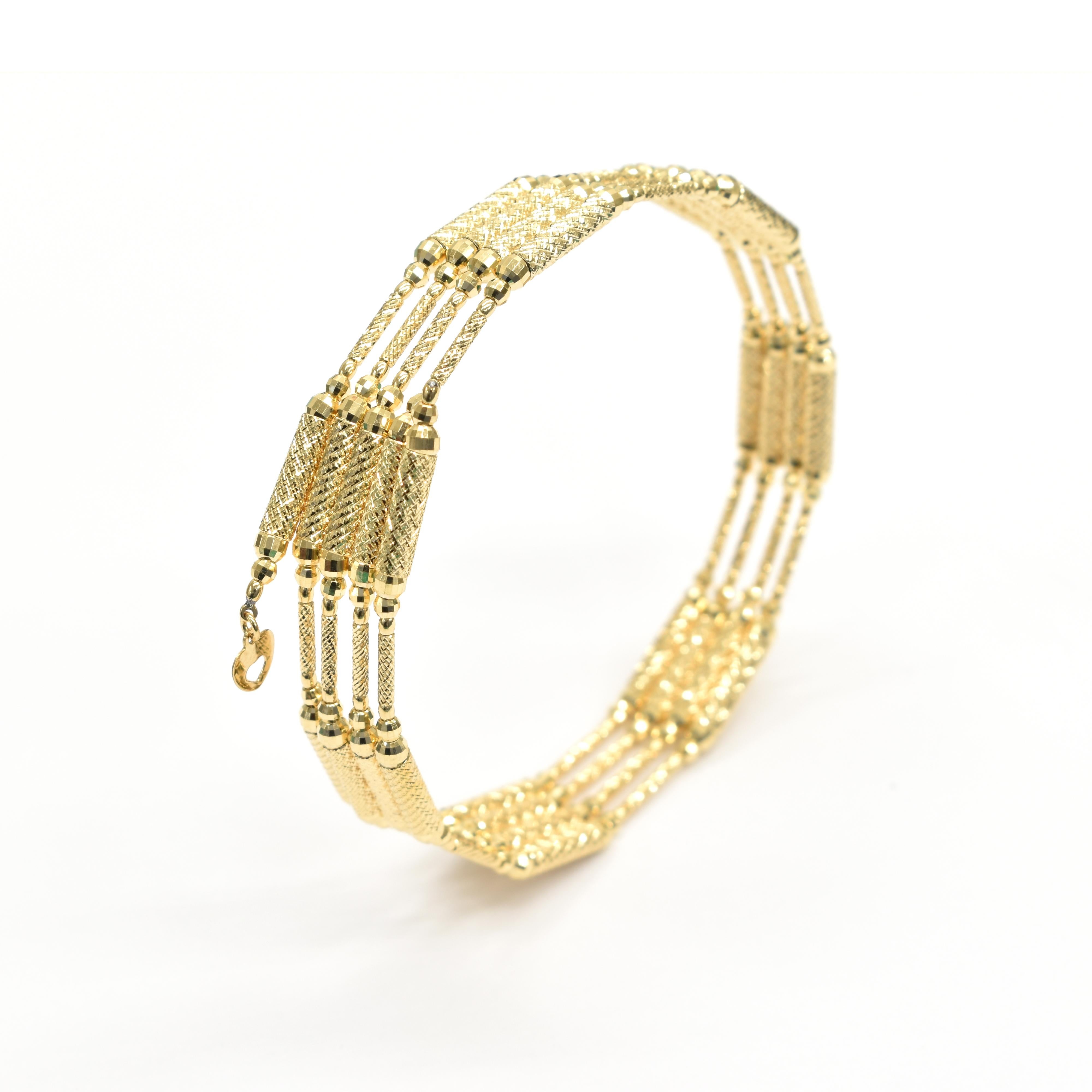 A stunning multi-use Bracelet-Necklace made in 18 Karat Yellow Gold with a magnetic mechanism. Approximately 6.5 grams of Gold. Can also be used as an anklet. Made in Japan. Contact us for more information!