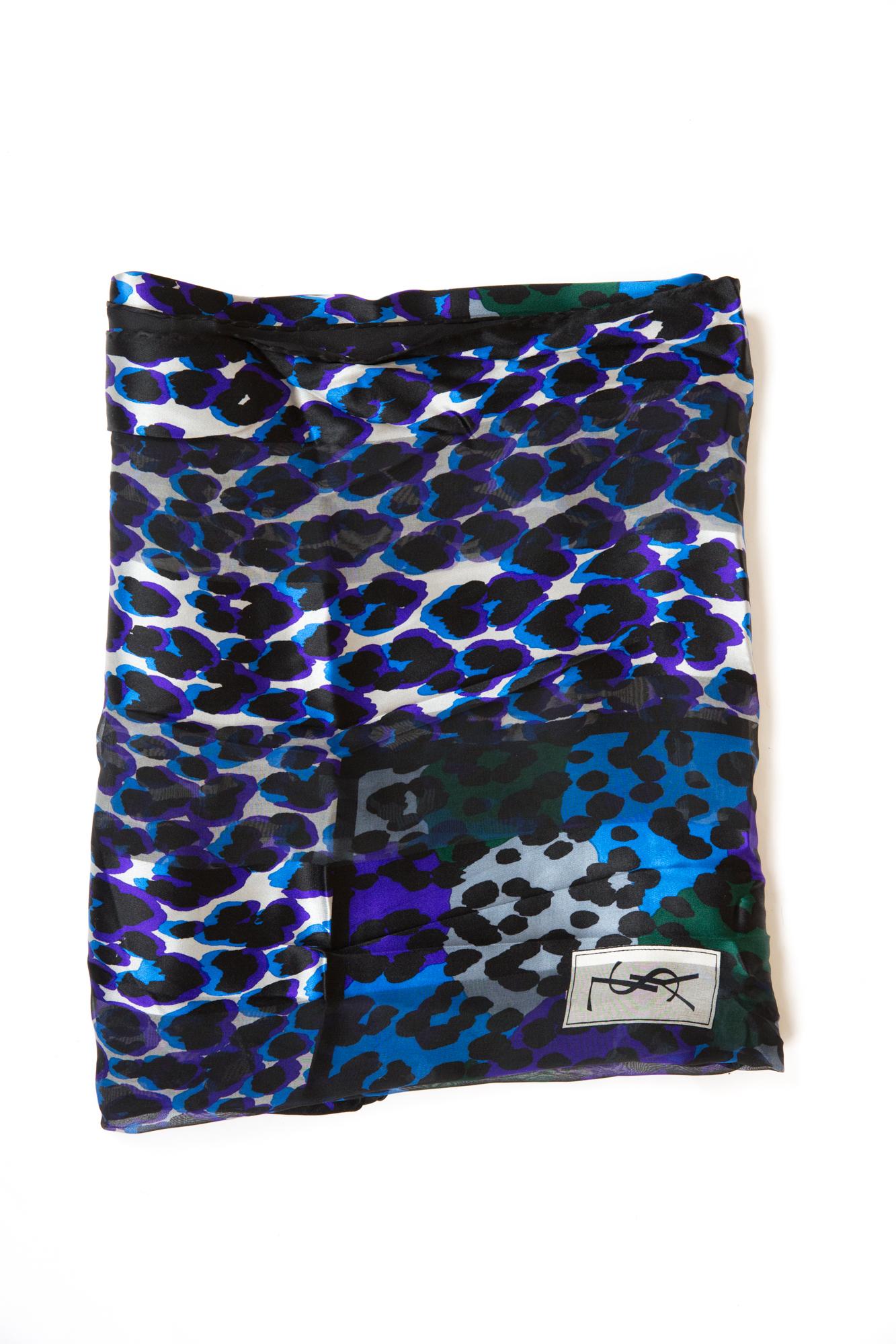 Gorgeous Saint Laurent YSL multicolour silk shawl ( 100% silk) featuring a large size, a blue & purple animal print, some mousseline parts and a logo signature.
Marked YSL
54.3 in. (138cm) X 53.5 in. (136cm) In excellent vintage condition.  
Made in