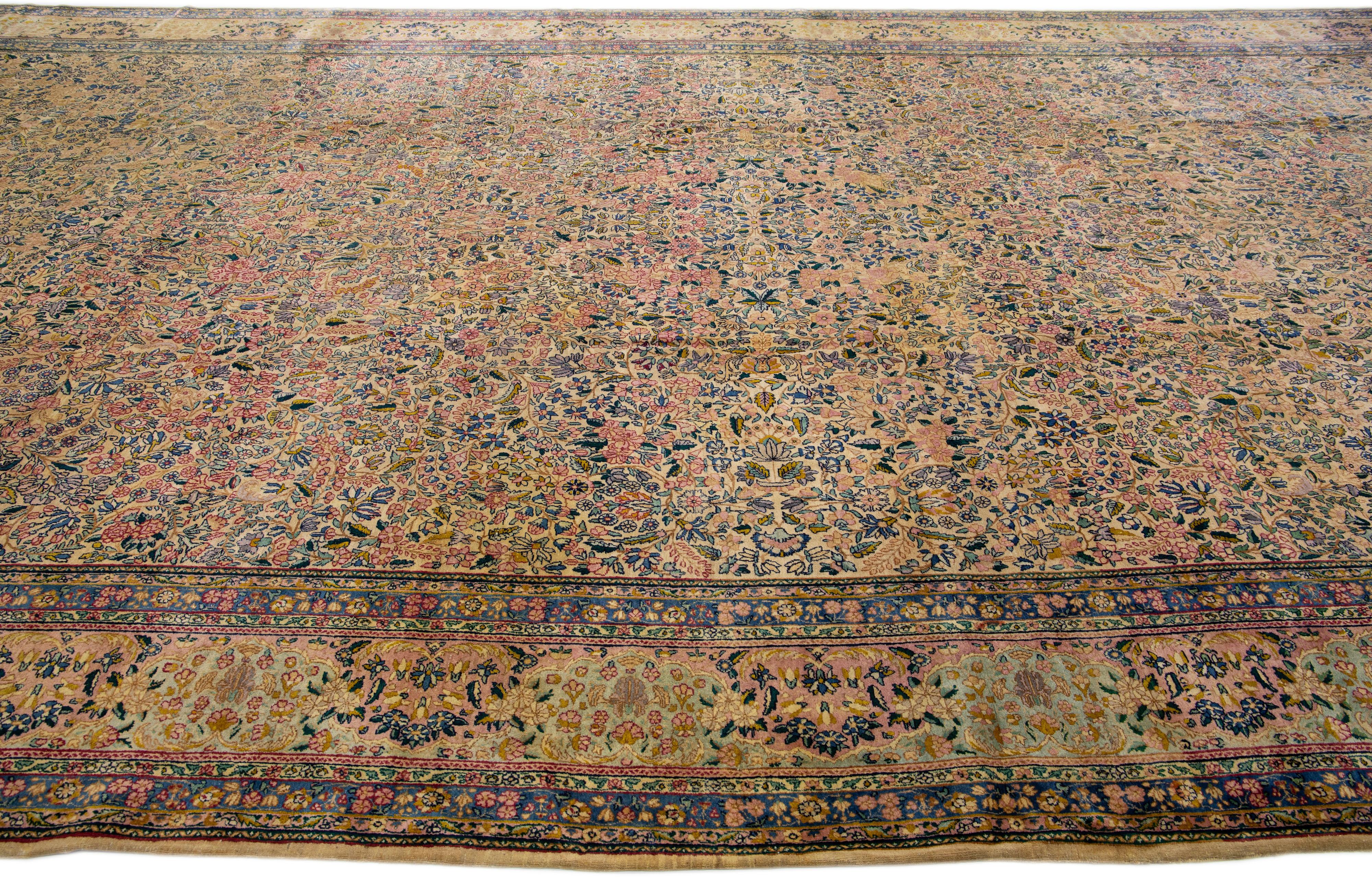 Multicolor Antique Kirman Handmade Allover Floral Oversize Wool Rug In Good Condition For Sale In Norwalk, CT
