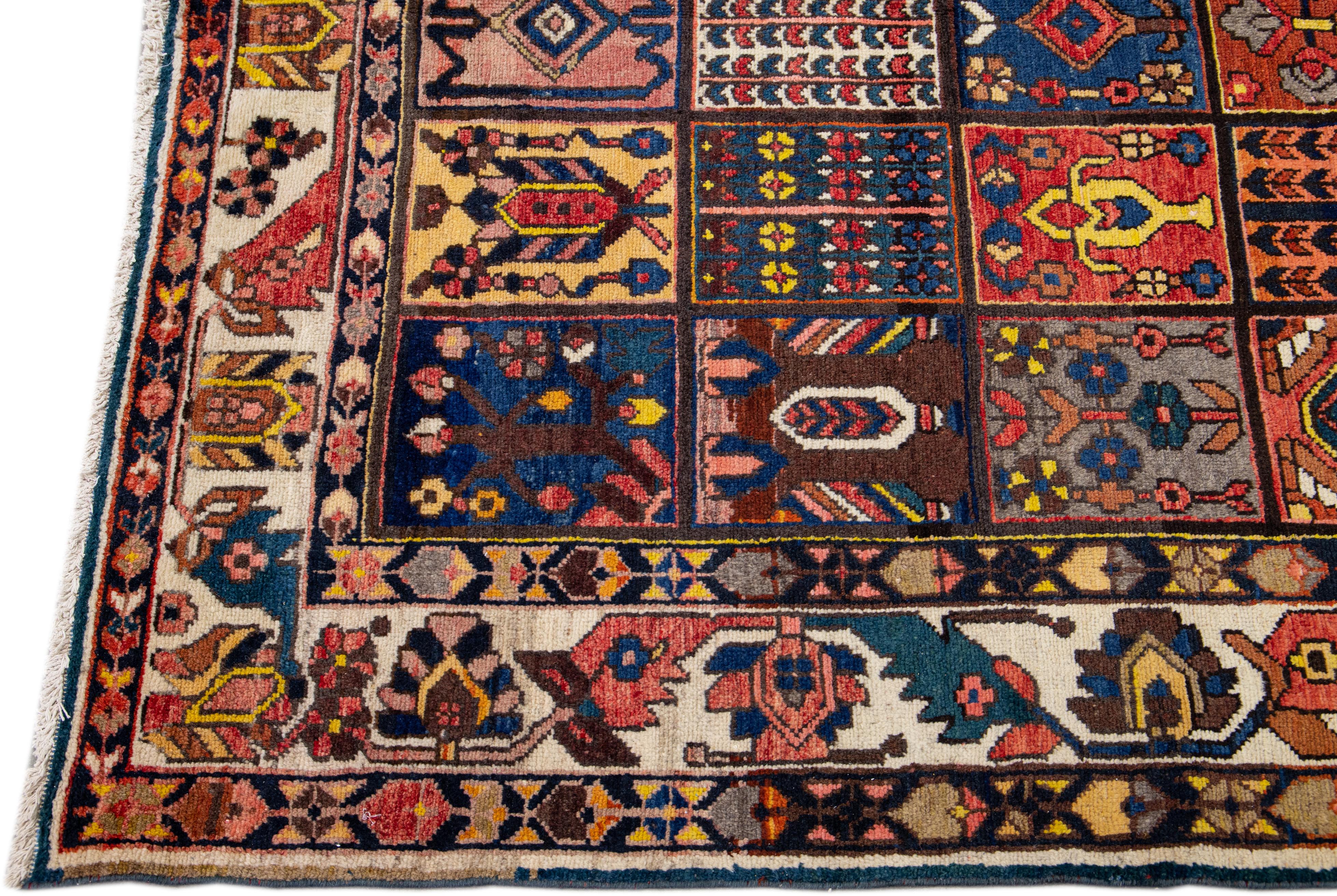 Hand-Knotted Multicolor Antique Persian Bakhtiari Handmade Allover Designed Wool Rug For Sale