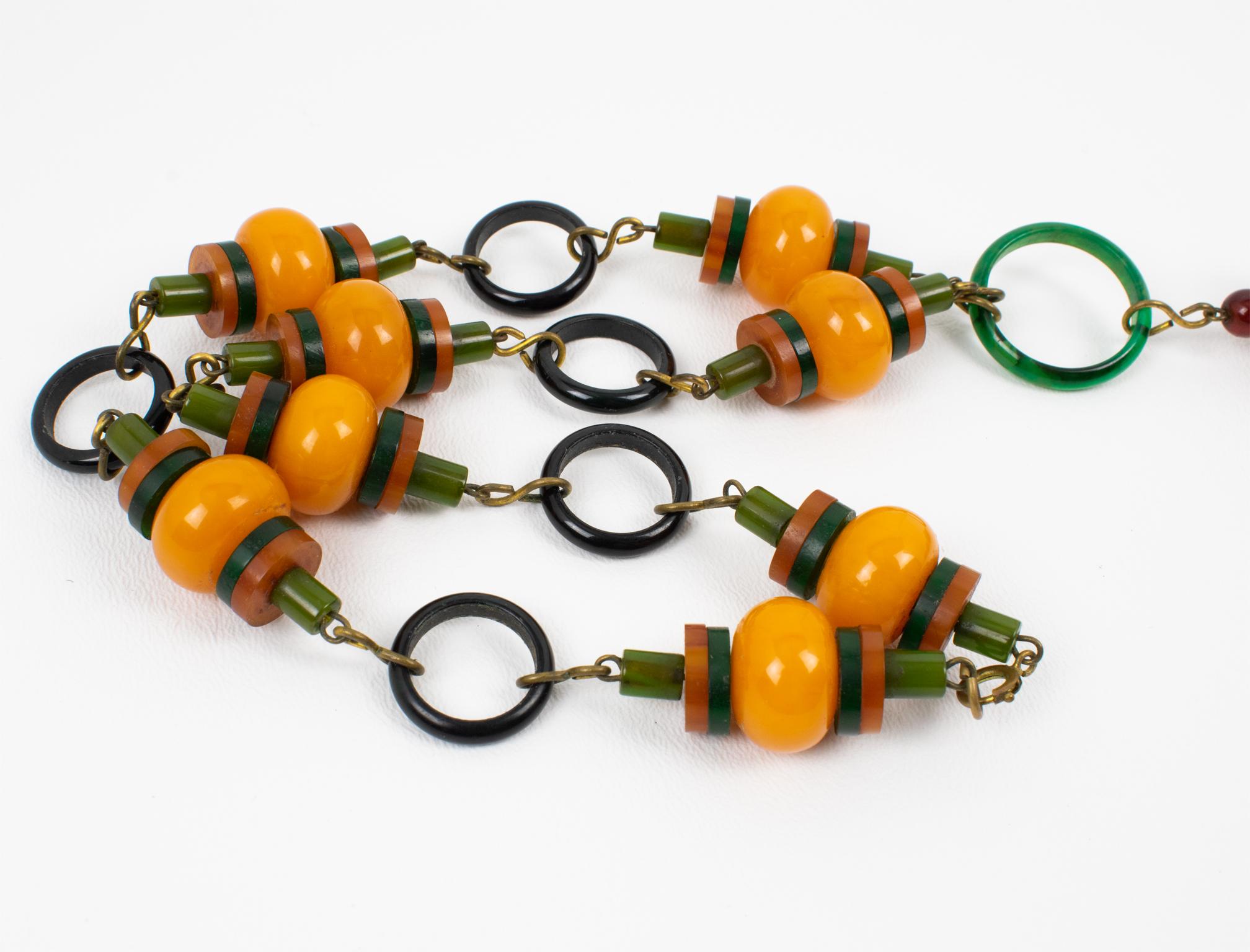 Multicolor Bakelite Long Necklace with Articulated Crib Toy Doll Pendant, 1940s For Sale 5