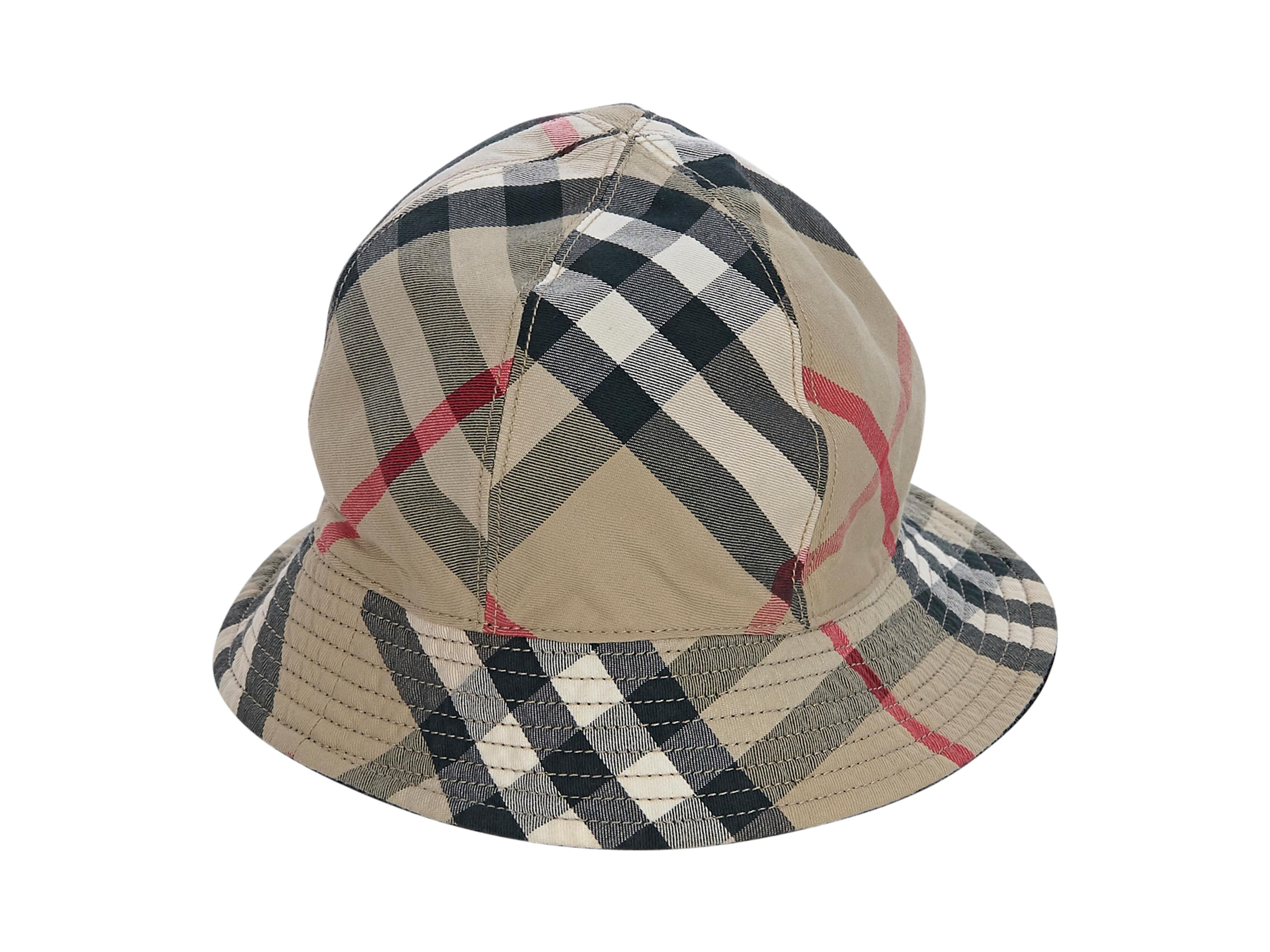 Product details:  Multicolor reversible plaid cotton bucket hat by Burberry. Lined interior. Style with a T-shirt and cropped straight-leg denim. 6.5
