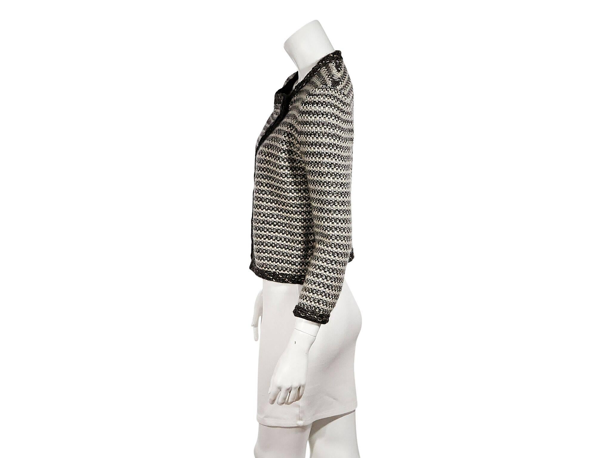 Product details:  Multicolor woven striped cashmere-blend cardigan by Chanel.  Jewelneck.  Three-quarter length sleeves.  Crossover double-breasted button closure.  Label size FR 38.  38