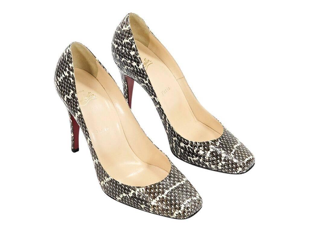 Product details:  Multicolor exotic python pumps by Christian Louboutin.  Round square toe.  Iconic red sole.  Slip-on style.  4.5