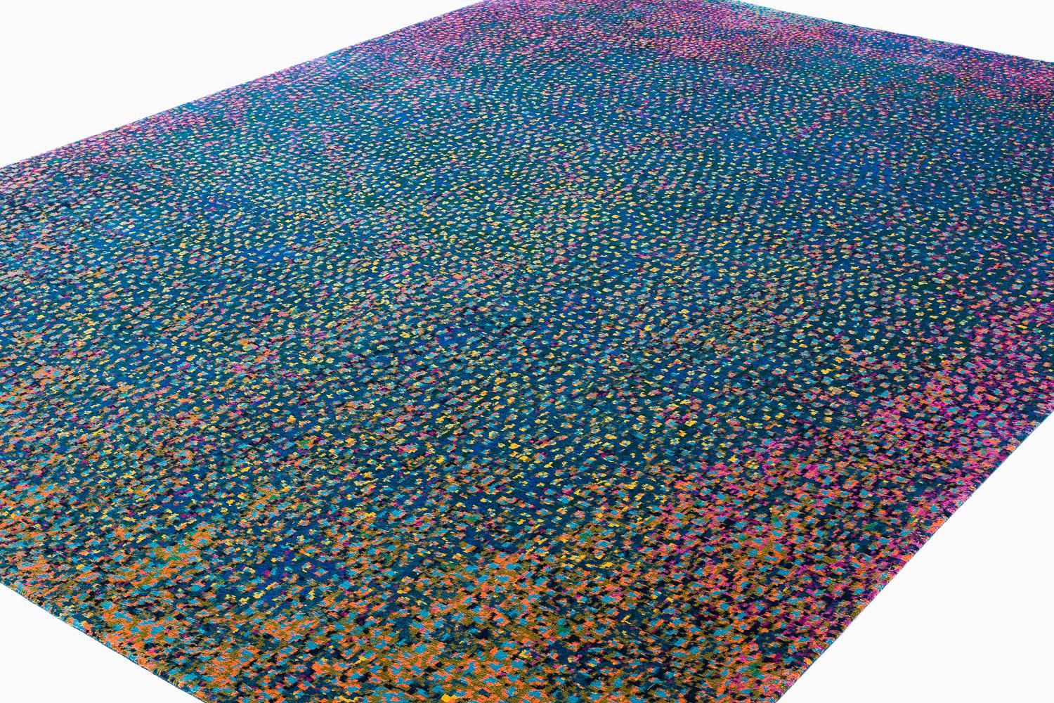 Questo tappeto contemporaneo e dinamico emula la luce che danza sul vetro multicolore. Rishikesh è un momento parigino del 1890-1910 ispirato a forme astratte come il vetro di Tiffany e alle colorazioni art nouveau. I mosaici, le vetrate e i colori