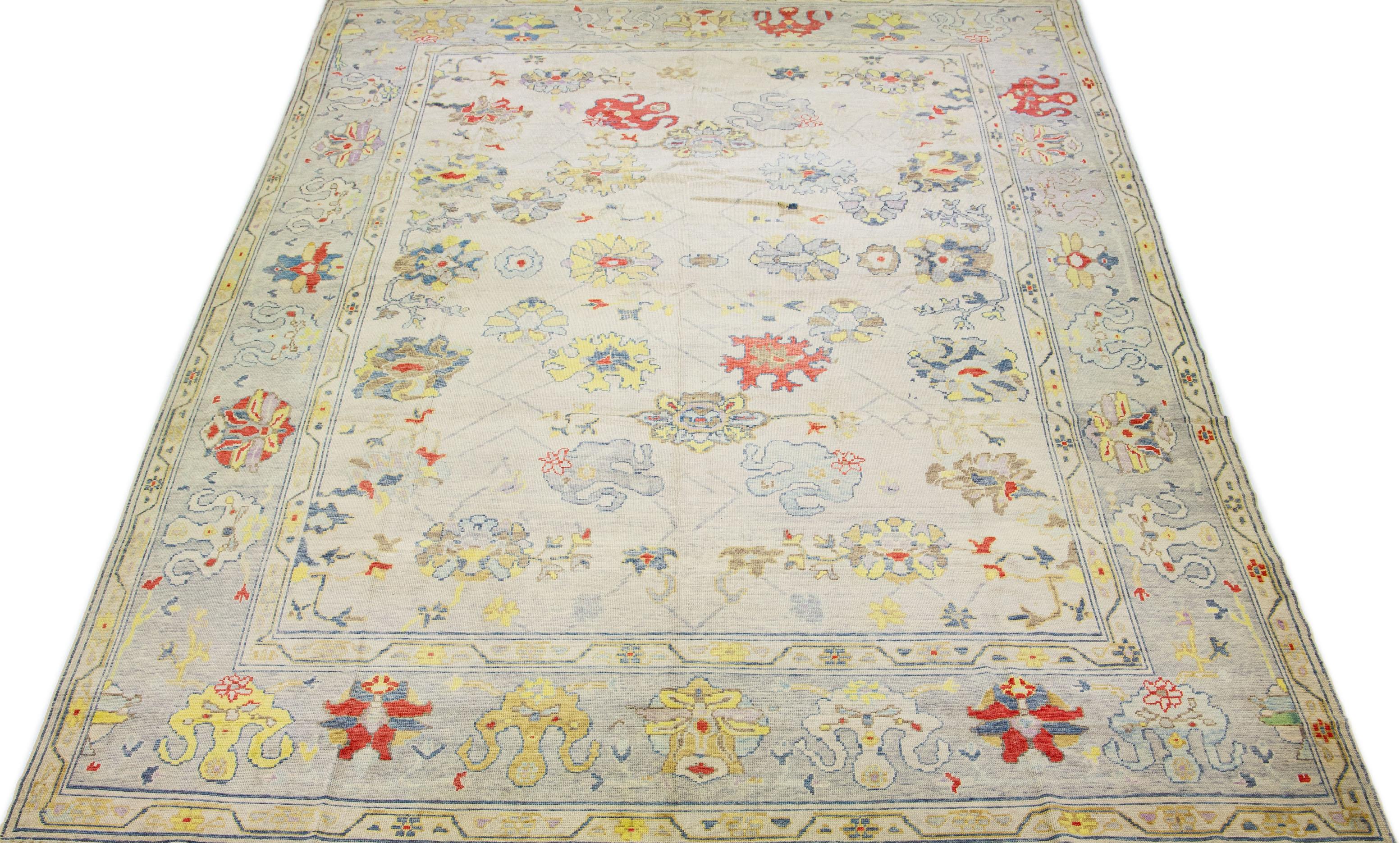 Elevate your interior space with the exquisite beauty of this flawless Turkish Oushak wool rug. This rug exudes pure luxury and refinement and is imbued with superior artistry and craftsmanship. Meticulously hand-knotted to perfection, its