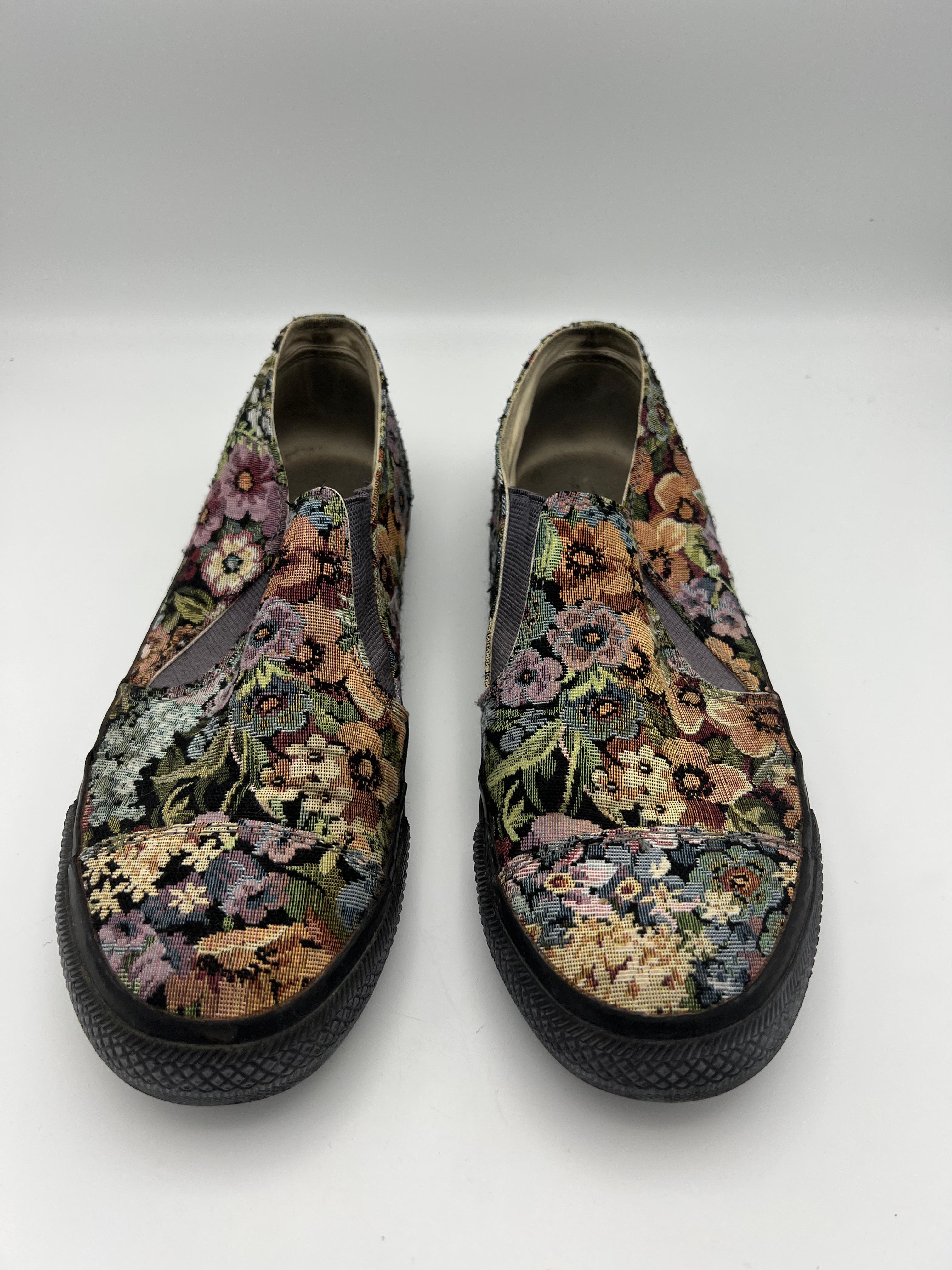 Product details:

The shoes feature multicolored floral pattern with embroidered finish and black sole.