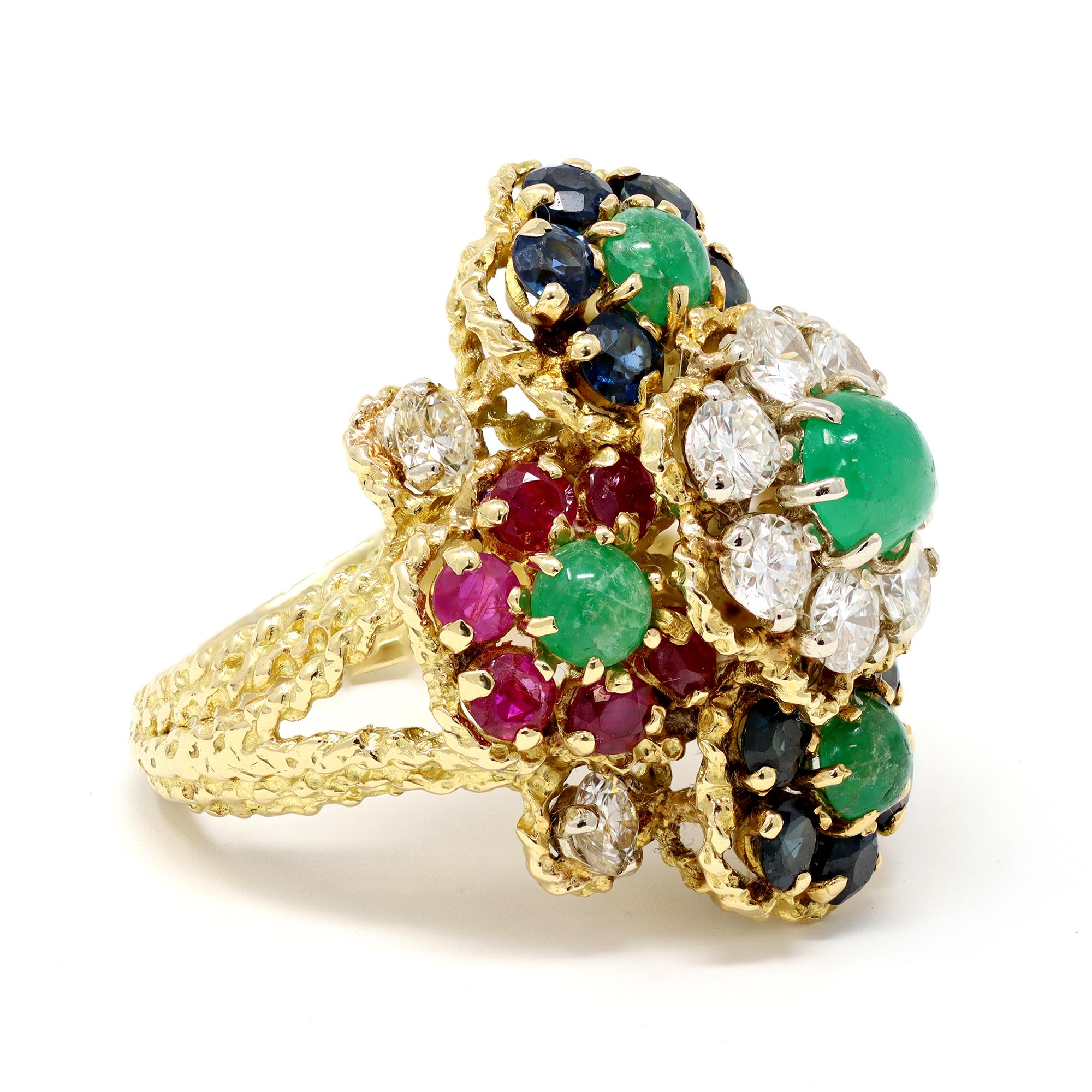 A classic cocktail design Circa 1960 featuring multicolor stones such as cabochon emeralds, faceted sapphires and rubies, with diamonds. The ring was created in 18 karat yellow gold. The estimated weight of the diamonds is 2.20 carats, GH color amd