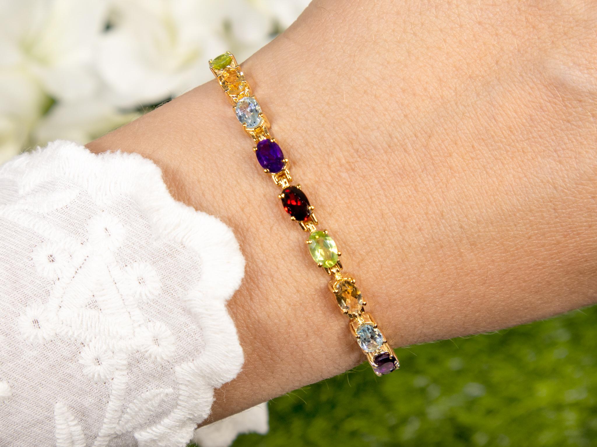 It comes with the Gemological Appraisal by GIA GG/AJP
All Gemstones are Natural
Gemstones: Amethysts, Blue Topazes, Citrines, Garnets, Peridots
Total Carat Weight = 8.95 Carats
Total Quantity = 20 Gemstones
Metal: 14K Yellow Gold Plated Sterling