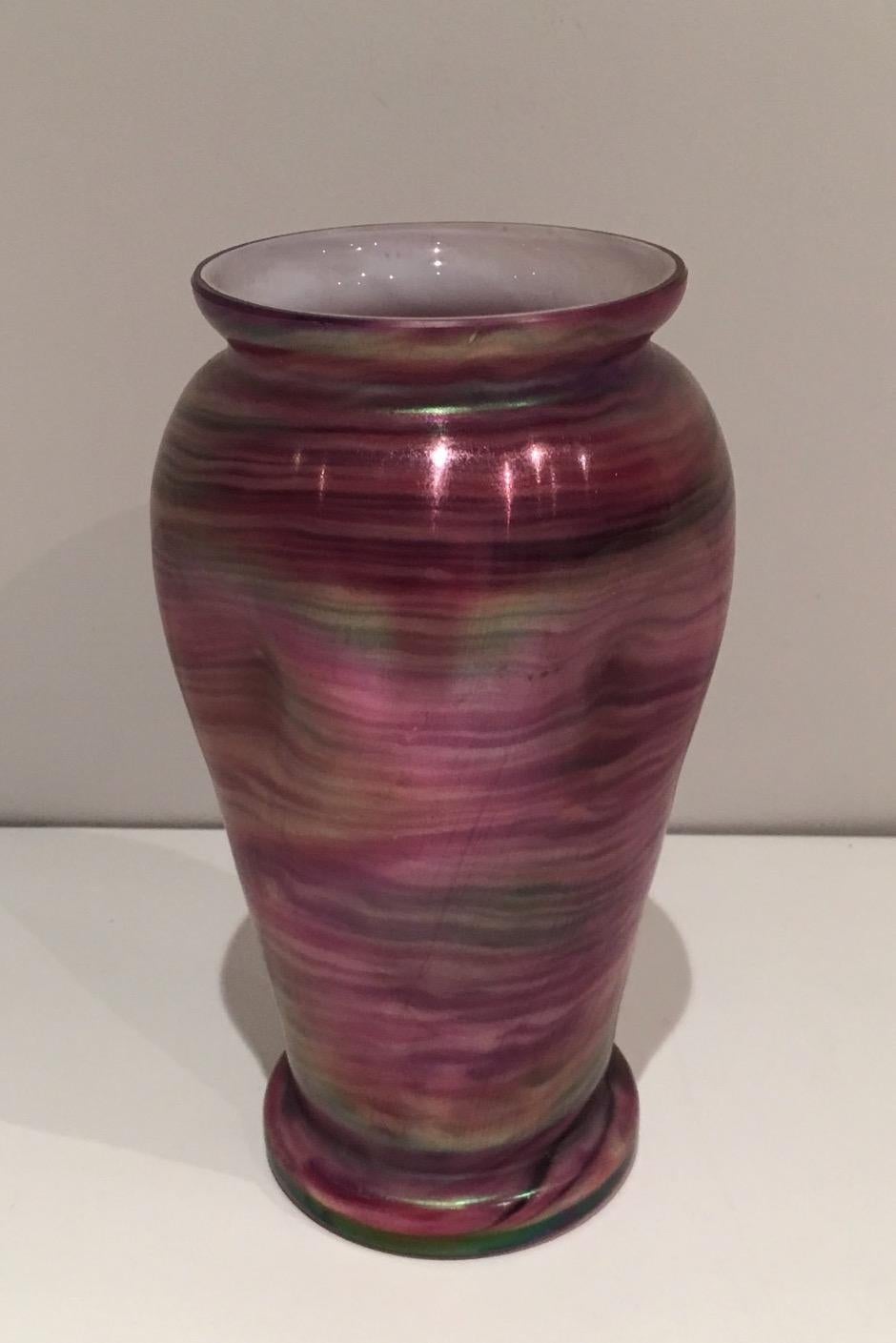 This vase is made of a multicolor glass. This is an Austrian work in the style of Loetz. Circa 1970.
