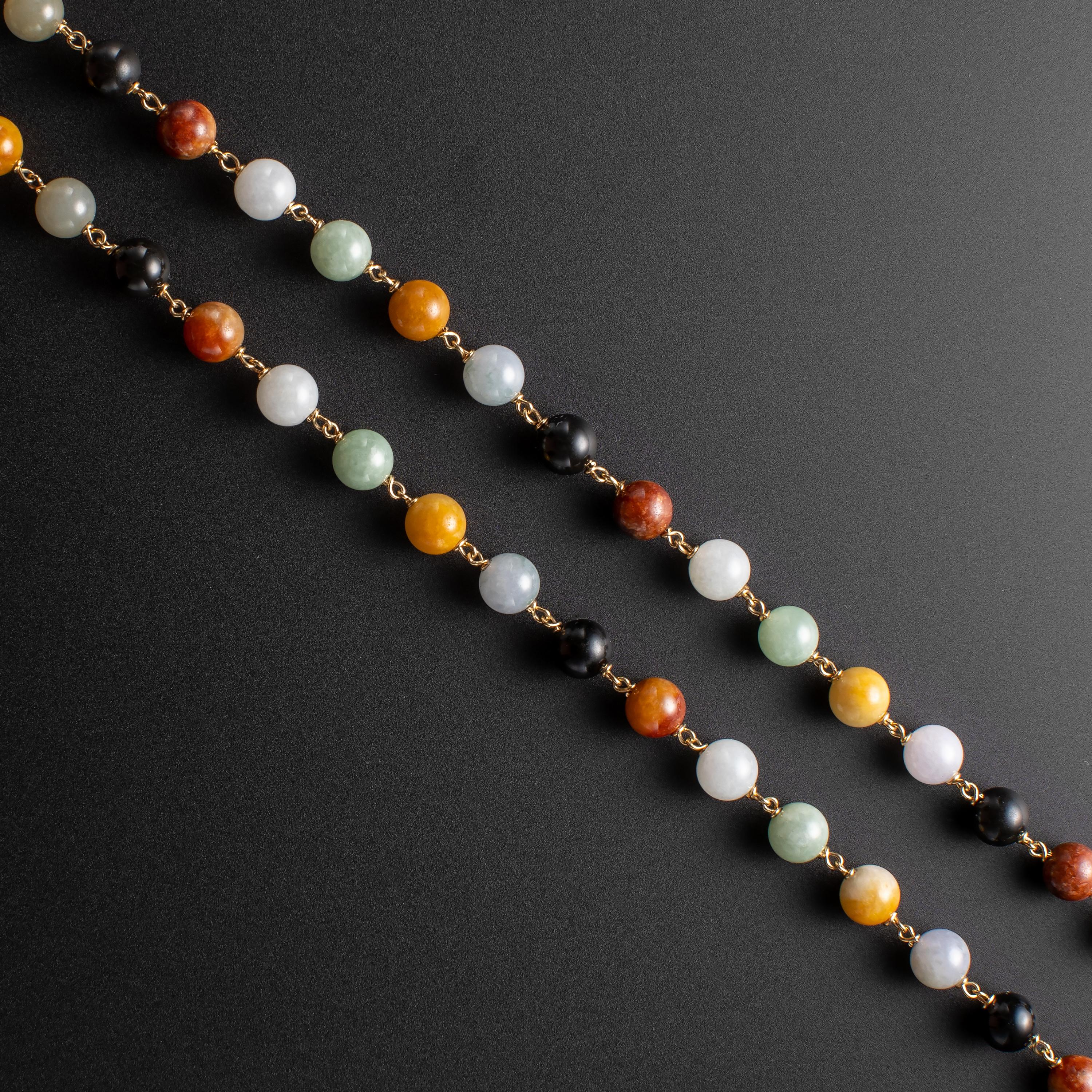 This multicolor jade necklace from the 1950s or thereabouts was created by the venerable Hawaiian jewelry store, Ming's. Like Gump's in San Francisco, Ming's became known worldwide for their fine jade jewelry, always created using only 100% natural