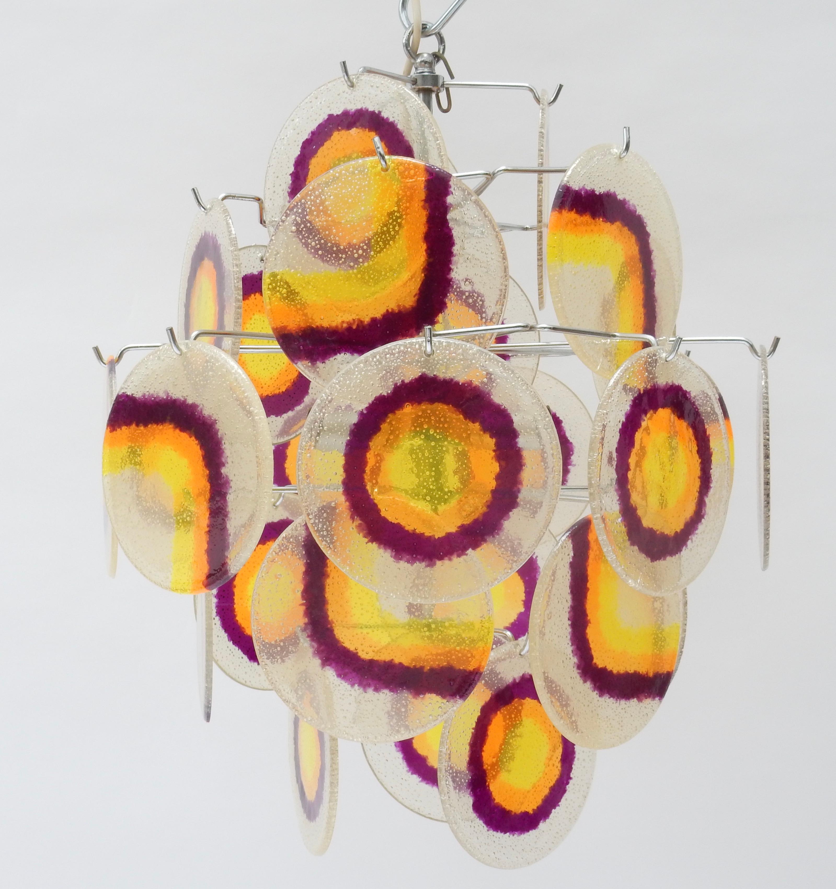 Lucite disc chandelier, 1970s with purple, orange and yellow patterns.