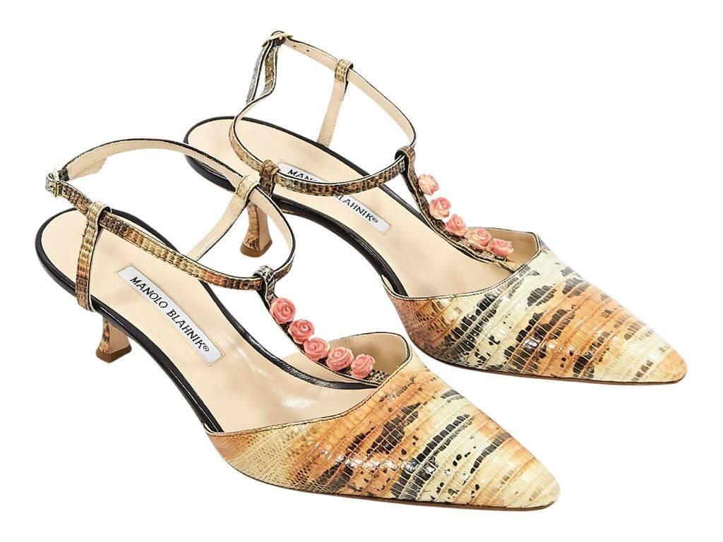 Product details:  Tan exotic skin kitten heels by Manolo Blahnik.  Adjustable ankle strap.  T-strap accented with coral floral applique.  Point toe.  Dust bag included.  Label size EU 41.5.  2.5