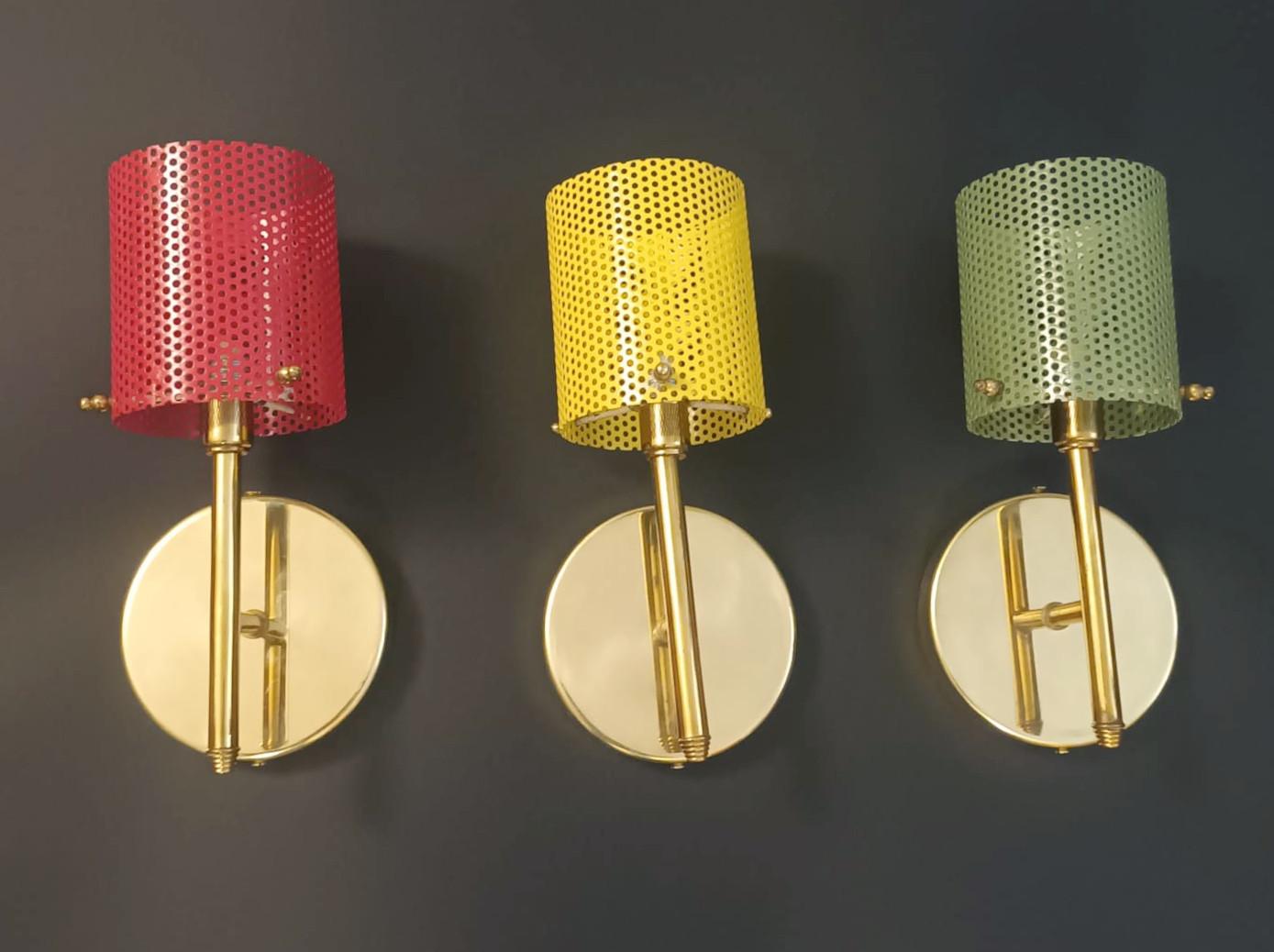 Midcentury Italian wall lights with red, green, and yellow perforated brass shades / Made in Italy in the style of Stilnovo, circa 1950s.
Measures: height 10 inches, width 4.7 inches, depth 4.7 inches, backplate diameter 4.7 inches
1 light / G9 type