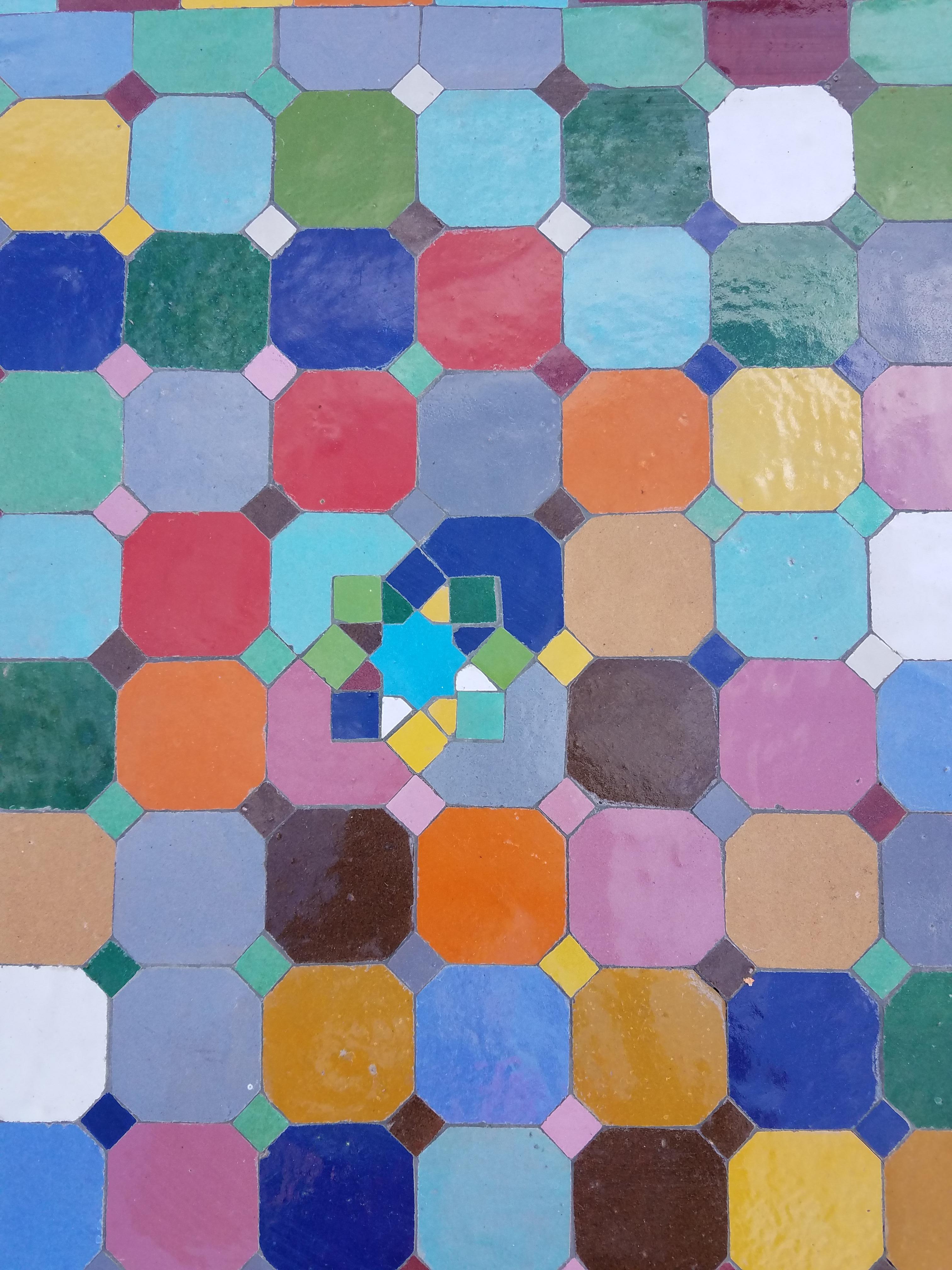 Beautiful multicolor mosaic tile table made in Morocco. Square shape. An indoor/outdoor table measuring approximately 24
