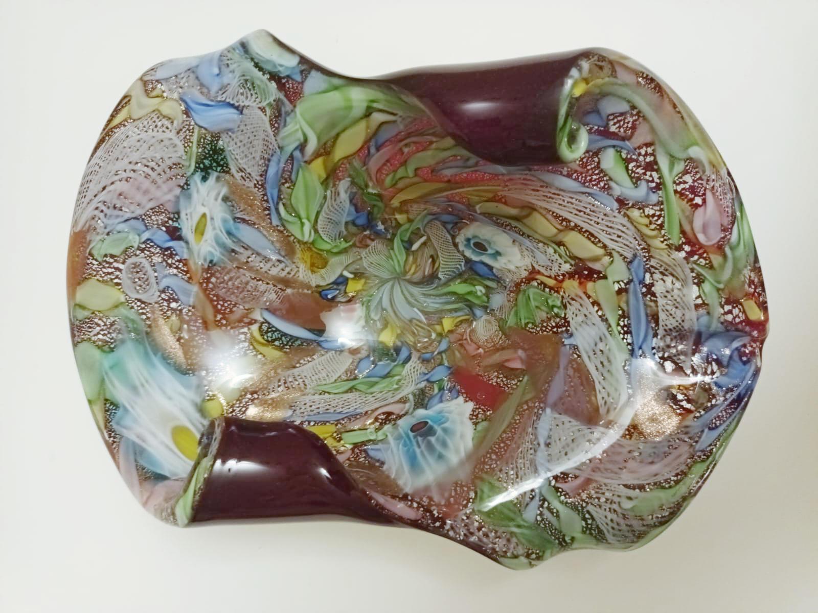 Vintage Italian multicolored Murano ashtray or bowl infused with silver and gold flecks / Made in Italy, circa 1960s
Measures: width 10 inches, depth 7 inches, height 4 inches
1 available in stock in Italy currently on 20% OFF SALE for $1,199