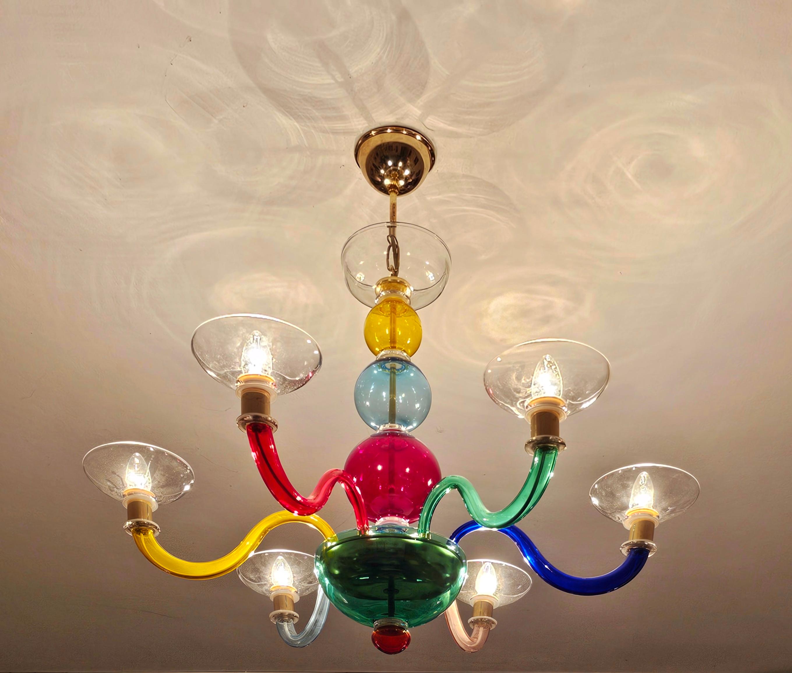 In this listing you will find a mesmerizing multicolor Murano Glass chandelier in style Gio Ponti for Venini. This 6-arm chandelier features beautiful mouthblown glass in 7 colours - yellow, red, green, pink, indigo, baby blue and clear glass - and