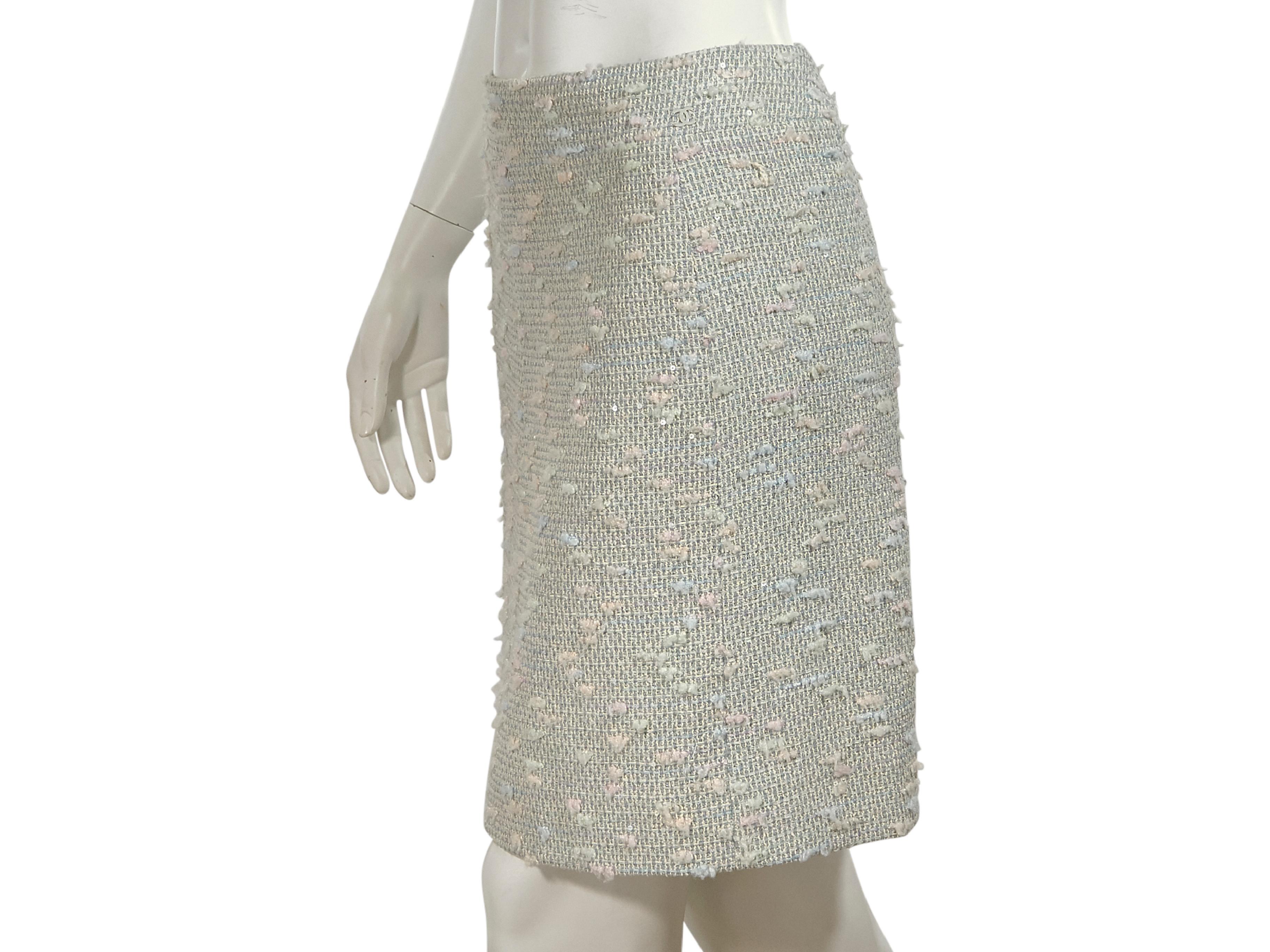Product details:  Multicolor pastel tweed pencil skirt by Chanel.  Accented with sequins.  Concealed back zip closure.  Label size FR 38.  27