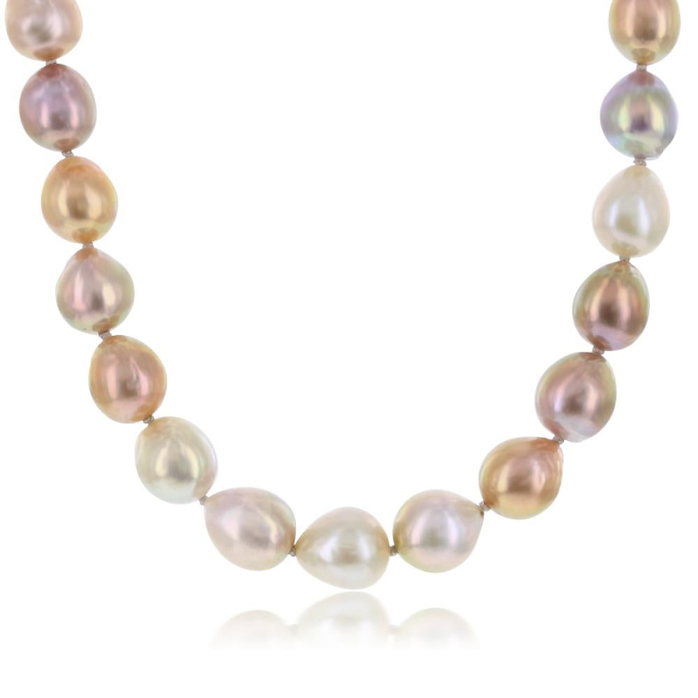 This natural color Pink Freshwater Baroque pearl necklace features fine quality, high luster 9x10mm pearls. The necklace is silk-knotted and measures 24