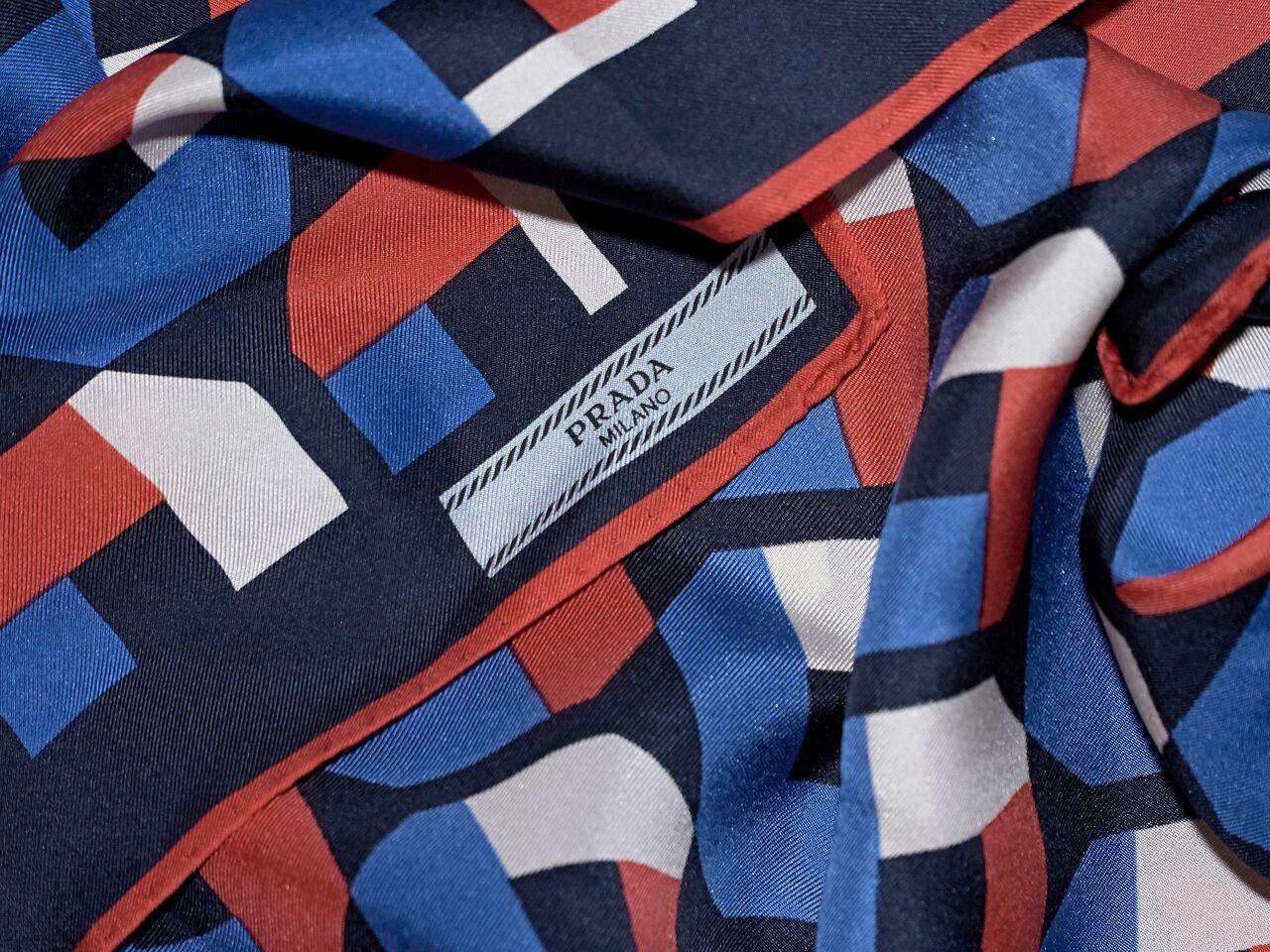 Product details:  Multicolor geometric-printed silk scarf by Prada.  24