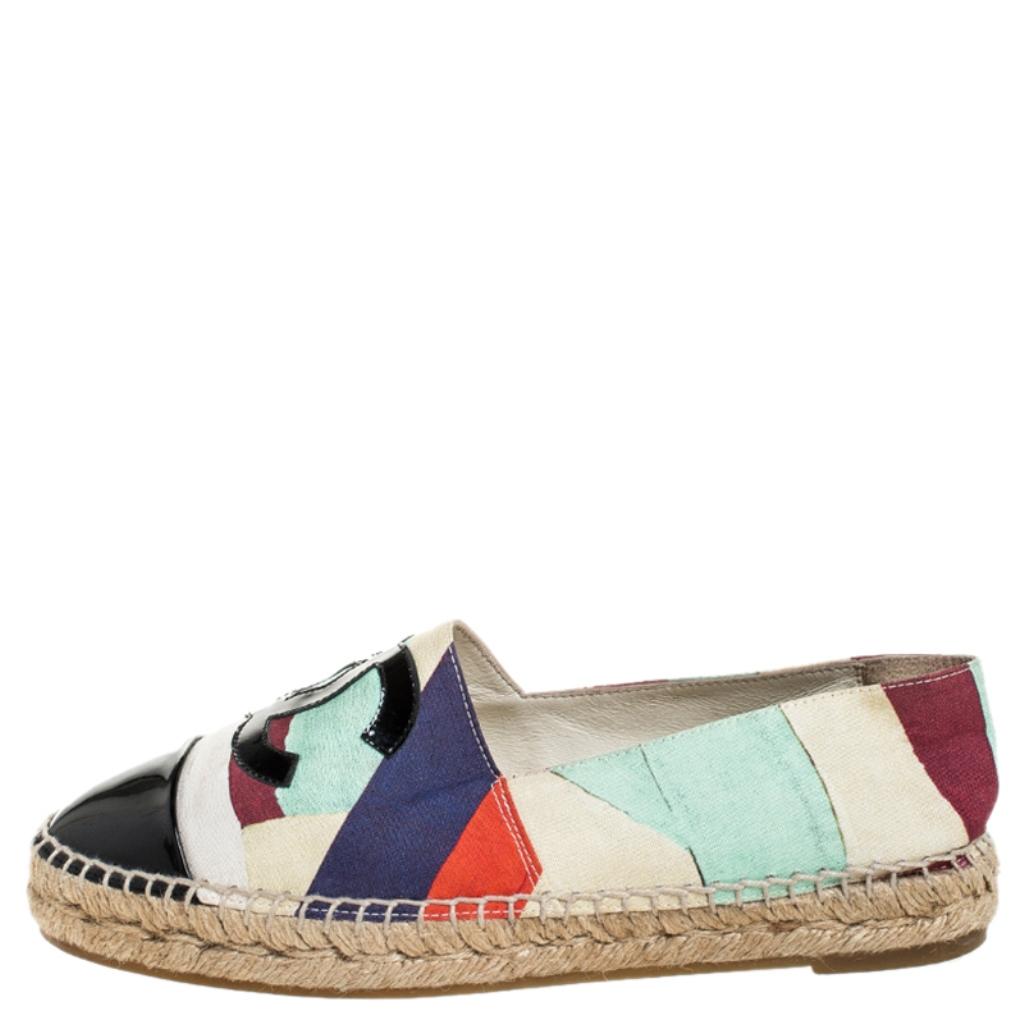 Espadrilles are not just stylish, but also comfortable and easy to wear. This lovely pair from Chanel will accompany a casual outfit with perfection. They are made of multicolor printed canvas and designed with the CC logo on the vamps and black