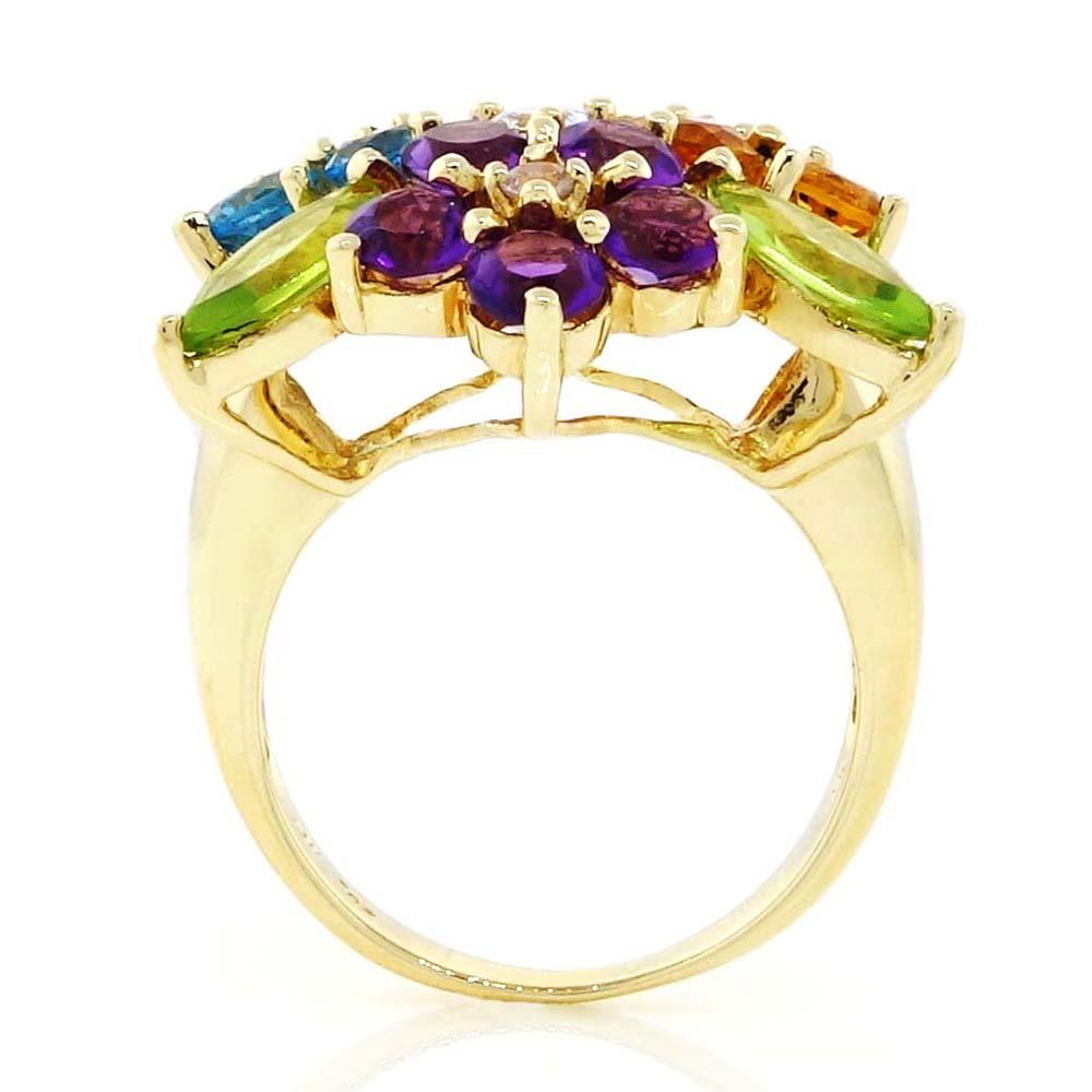 Multicolor ring containing 5 round shape Topaz of about 1.00 carats, 5 round shape Citrines of about 1.00 carats, 5 round shape Amethysts of about 1.00 carats, 3 pear shape Peridots of about 0.80 carats and 4 round shape Zirconia (CZ) of about 0.30