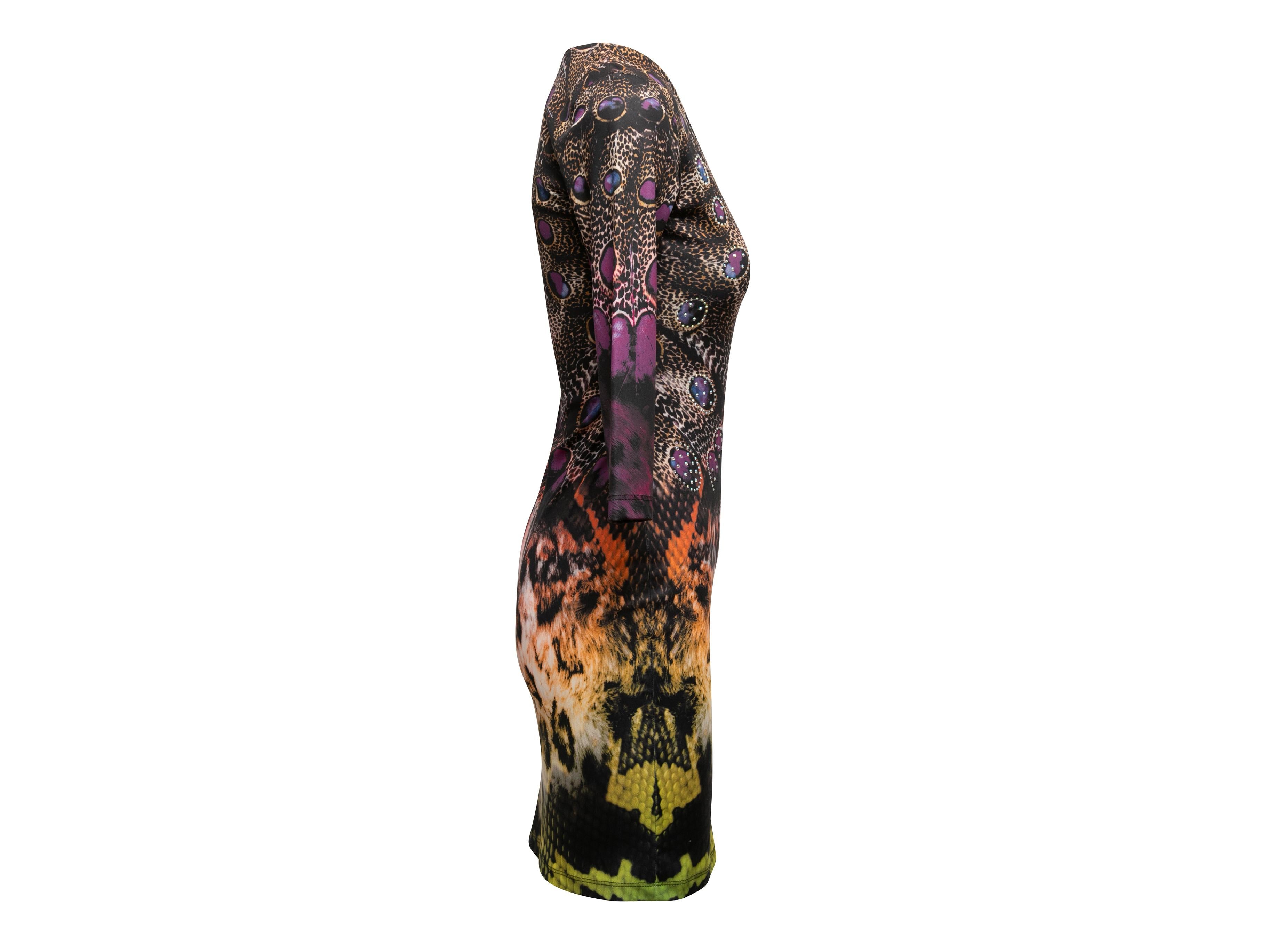 Multicolor animal print bodycon dress by Roberto Cavalli. Scoop neckline. Three-quarter sleeves. Rhinestone embellishments throughout. 33