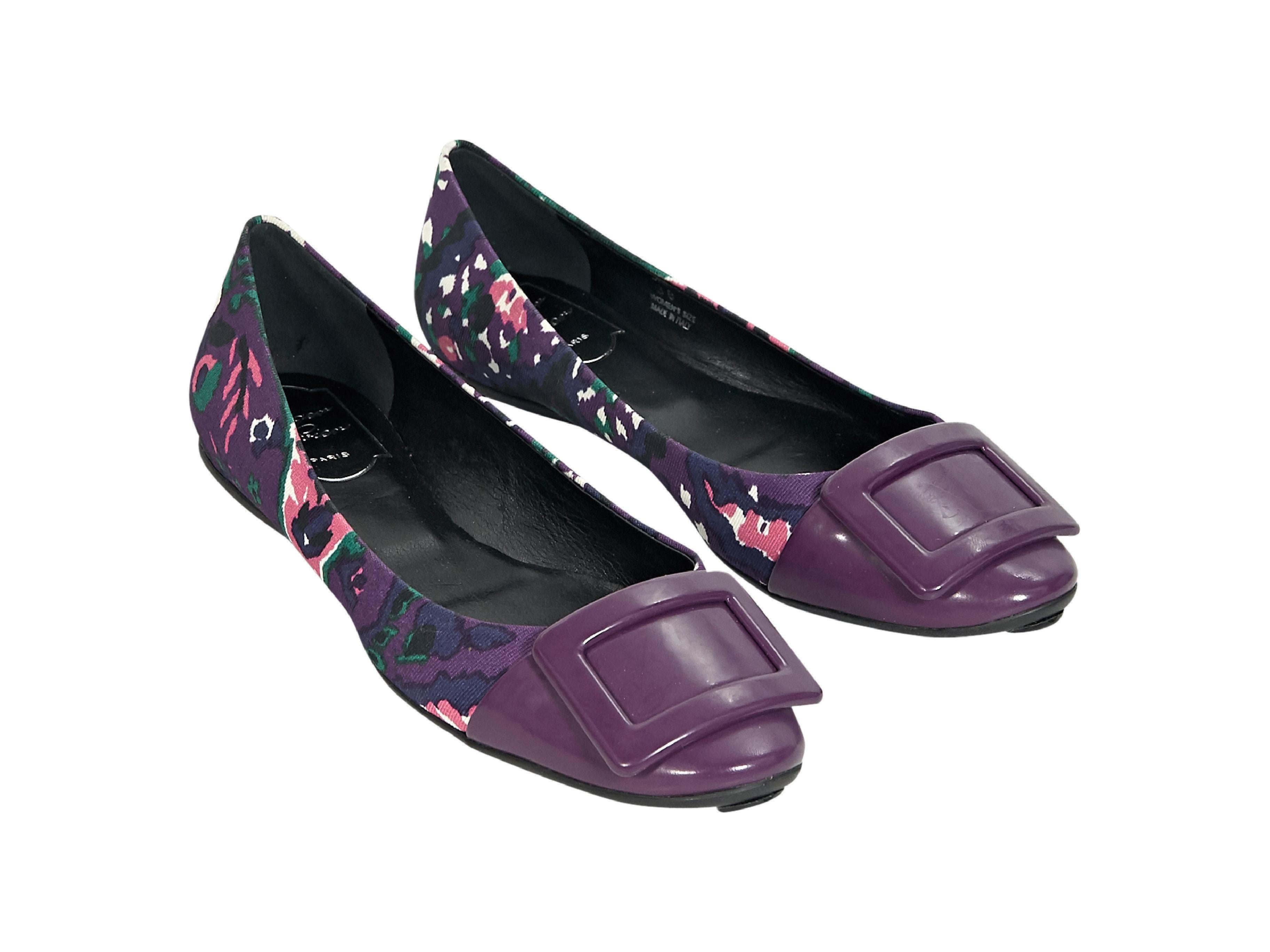 Product details:  Multicolor floral-printed ballet flats by Roger Vivier.  Buckle accents vamp.  Round toe.  Slip-on style. 
Condition: Pre-owned. Very good. 
Est. Retail $ 650.00
