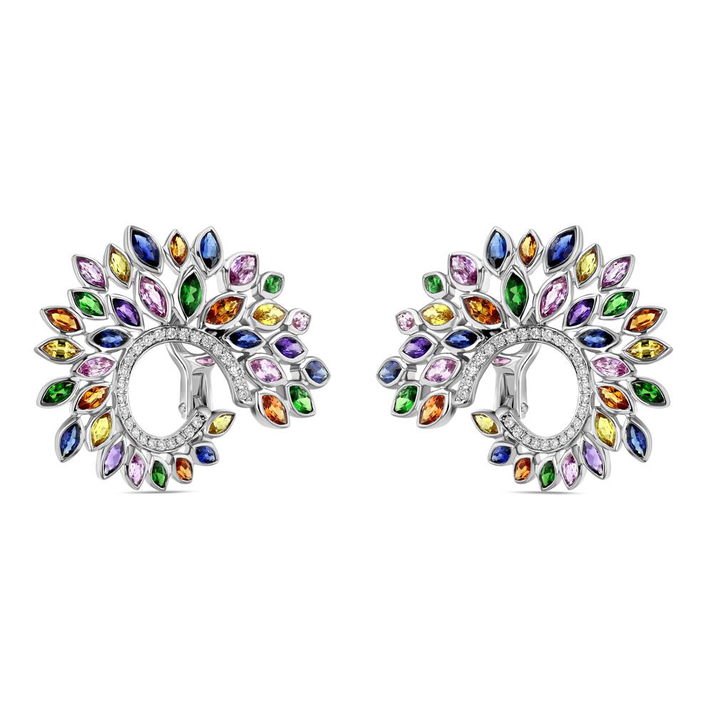 These white gold and multicolored sapphire earrings are superb. In light the multicolored sapphires reflect a rainbow of brilliant colors, and the actual design of the earrings further adds wonderous intricacy in that its ambiguity allows it to