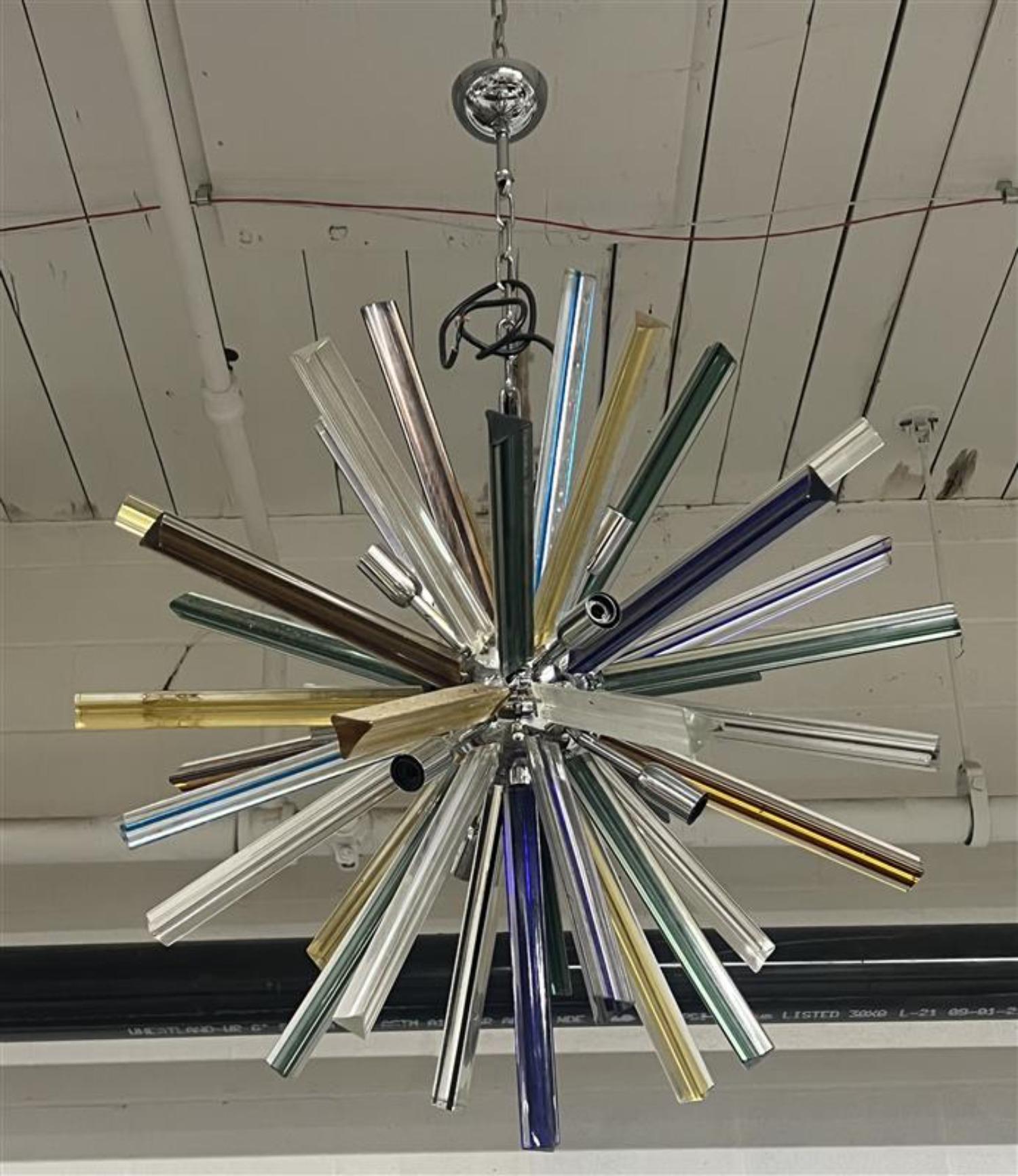 This colorful chandelier is sure to make a statement and add life to any room
Murano Triedi Mix Colored Sputnik- chain is adjustable 
Rewiring recommended 