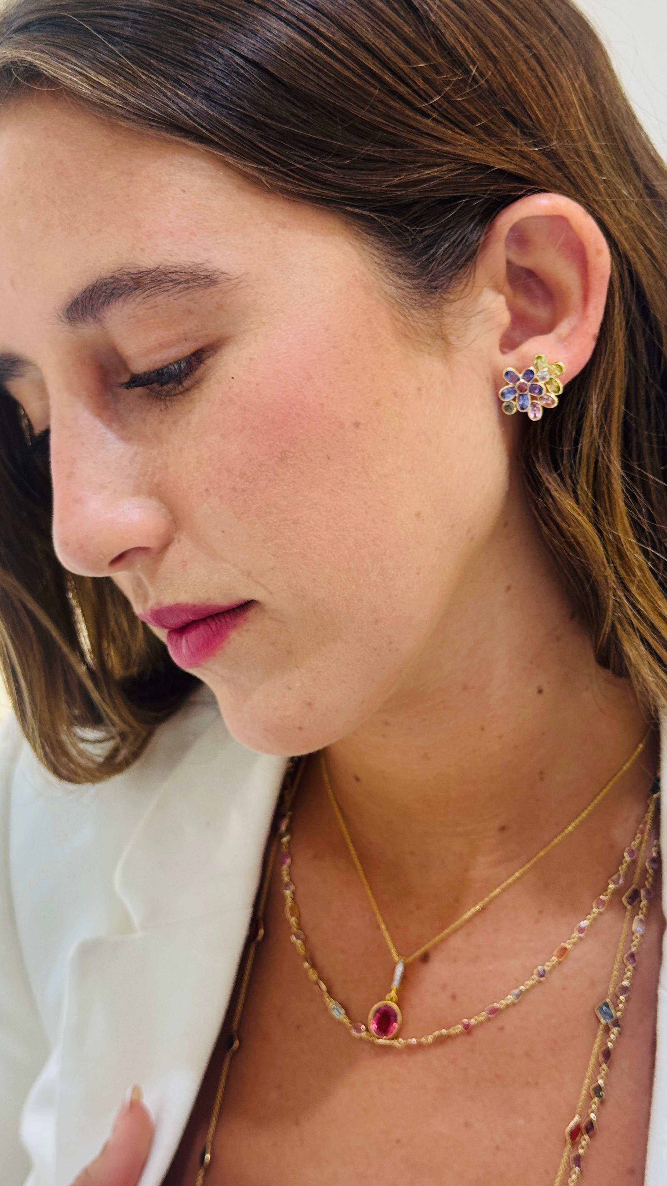 Tresor Beautiful Earring feature 5.76 carats of Multicolor Stone. The Earring is an ode to the luxurious yet classic beauty with sparkly gemstones and feminine hues. Their contemporary and modern design make them perfect and versatile to be worn at
