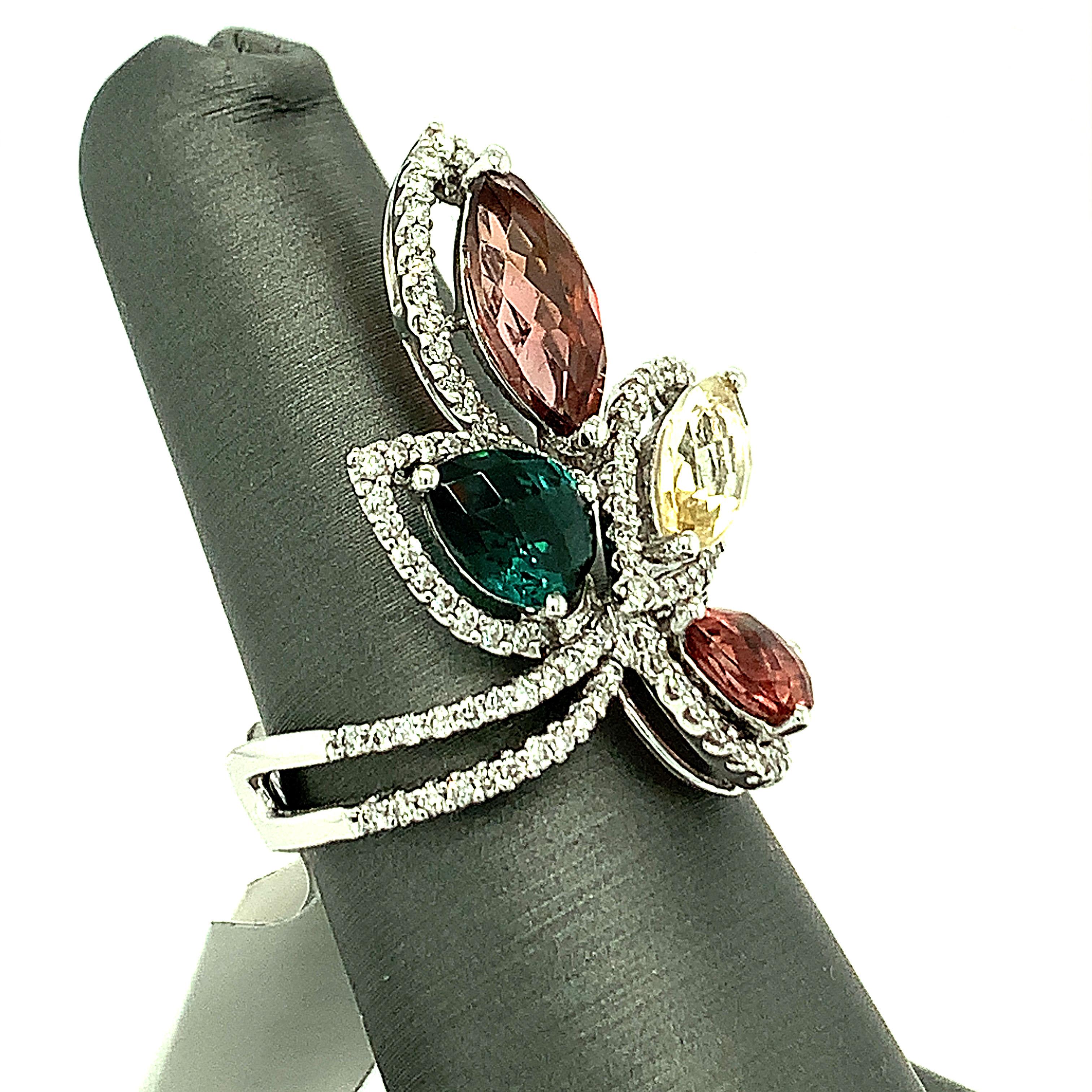 This beautiful cocktail ring boasts a spectacular radiance of majestic cluster of multicolor tourmaline and diamond. Two drop and two marquise cut tourmalines are embellished with micro set white diamonds.
Total Tourmaline: 3.5cts